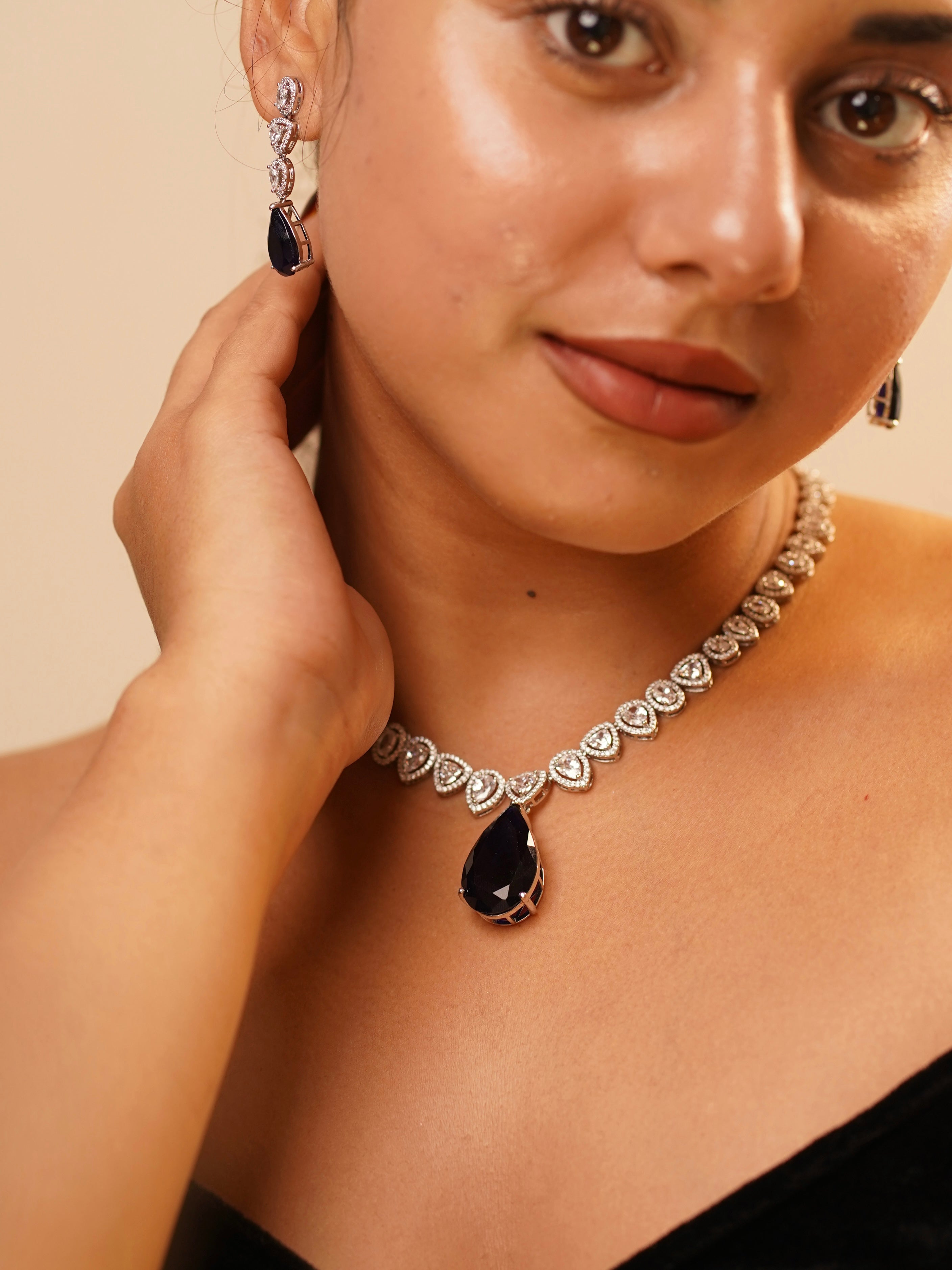 Angled view of yellow diamond necklace with shimmering halo and elegant chain