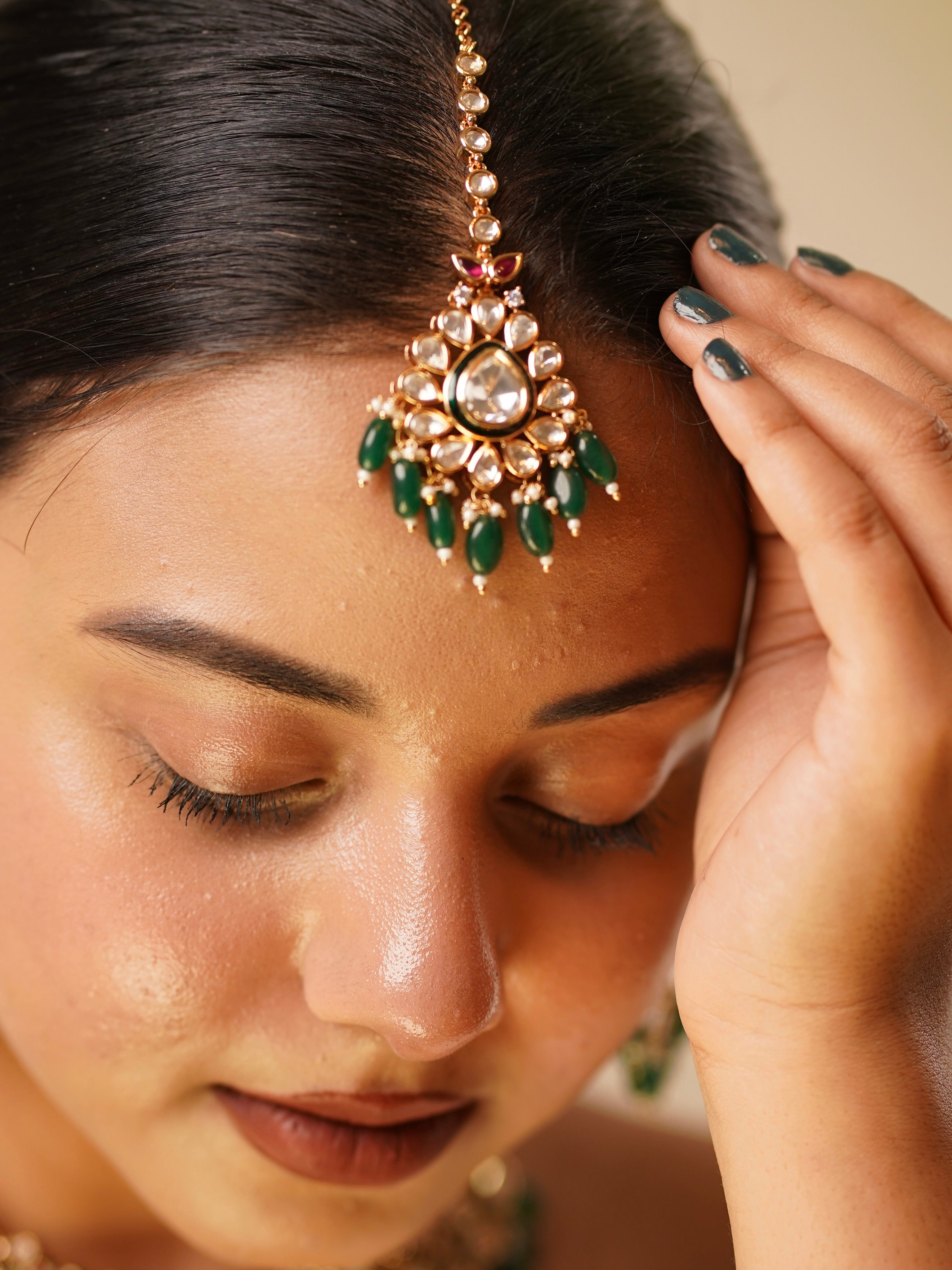 Close-up of jadau bridal set highlighting intricate gold finish and stone placement