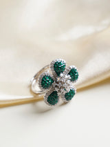 angled close‑up capturing layered baguette set petals of luxe mosaic floral cocktail ring