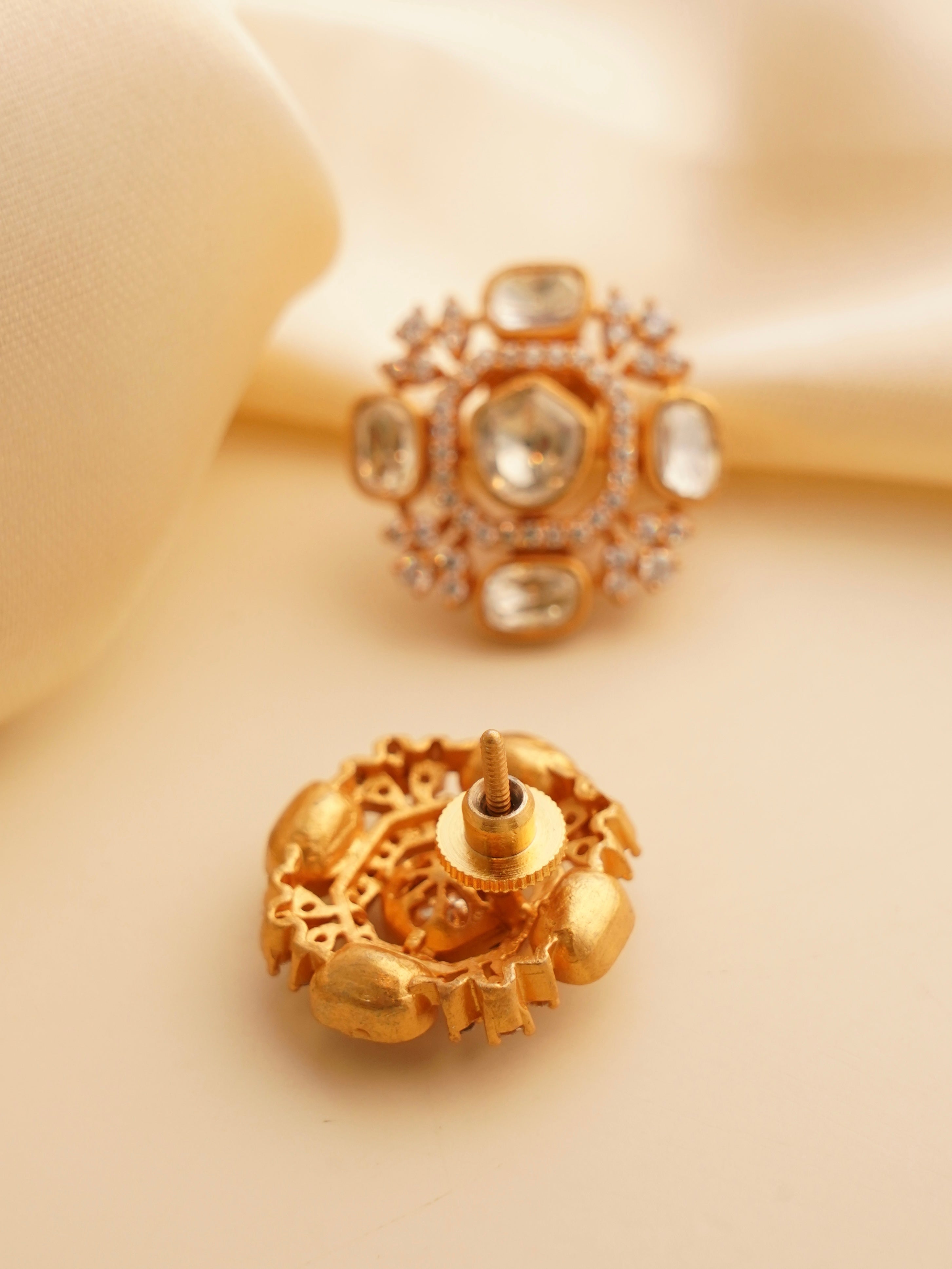 Close-up of moissanite stud earrings with screw back and round brilliant cut stones in high-polish finish