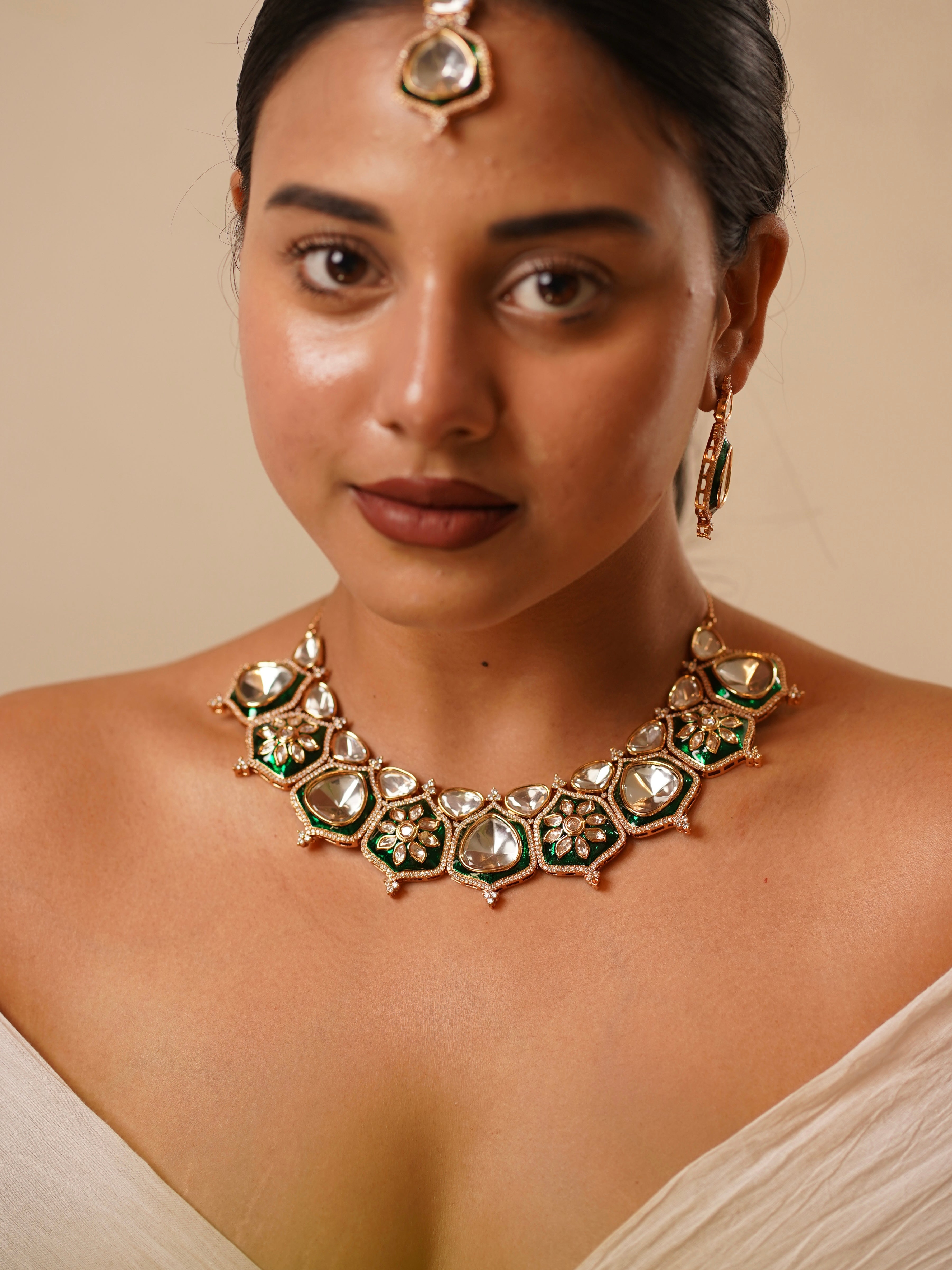 Kundan necklace set with green enamel and polki stones, includes earrings and maangtikka, front view