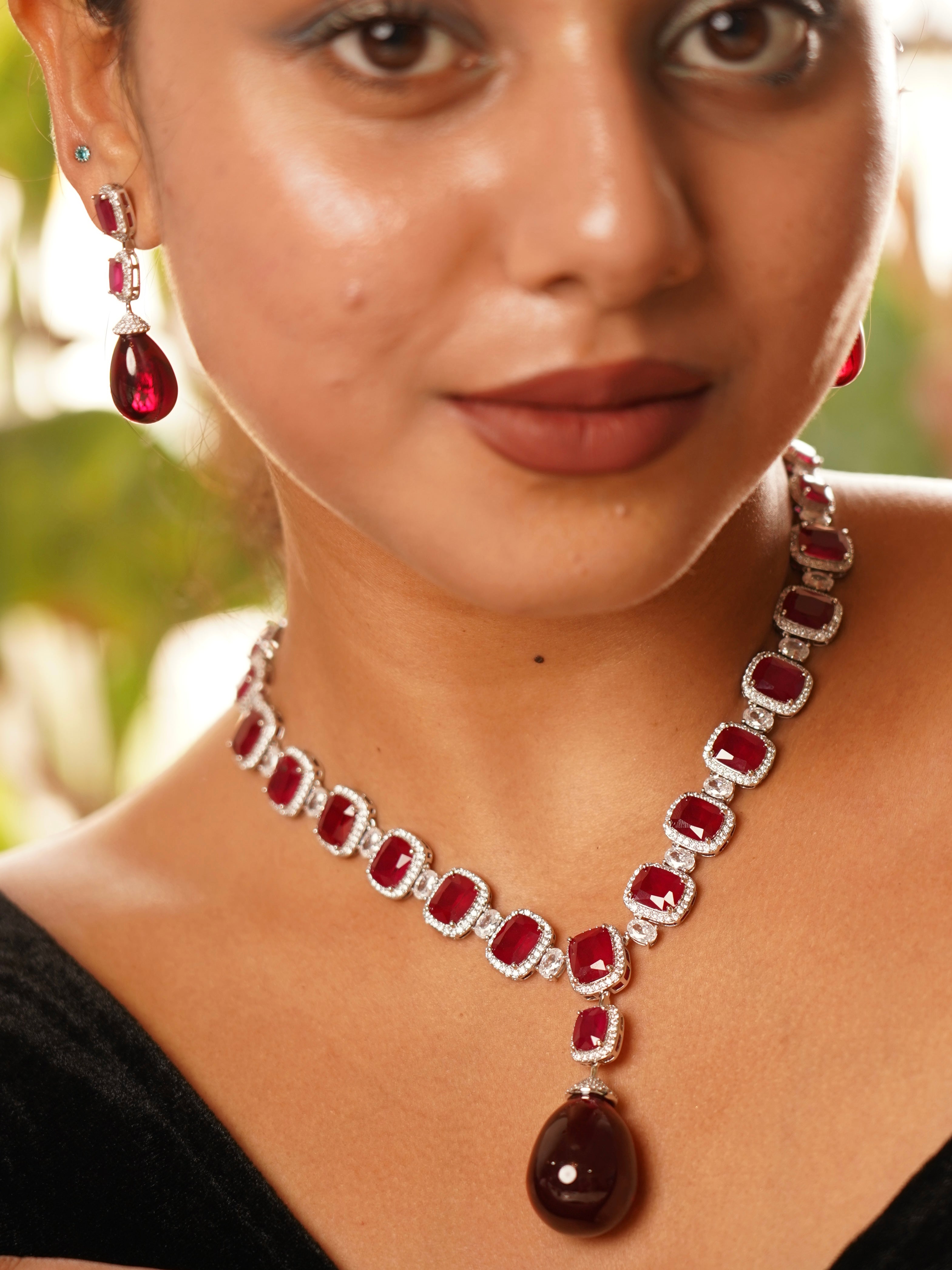 Frontal shot of ruby necklace from the empress suite with intricate diamond accents