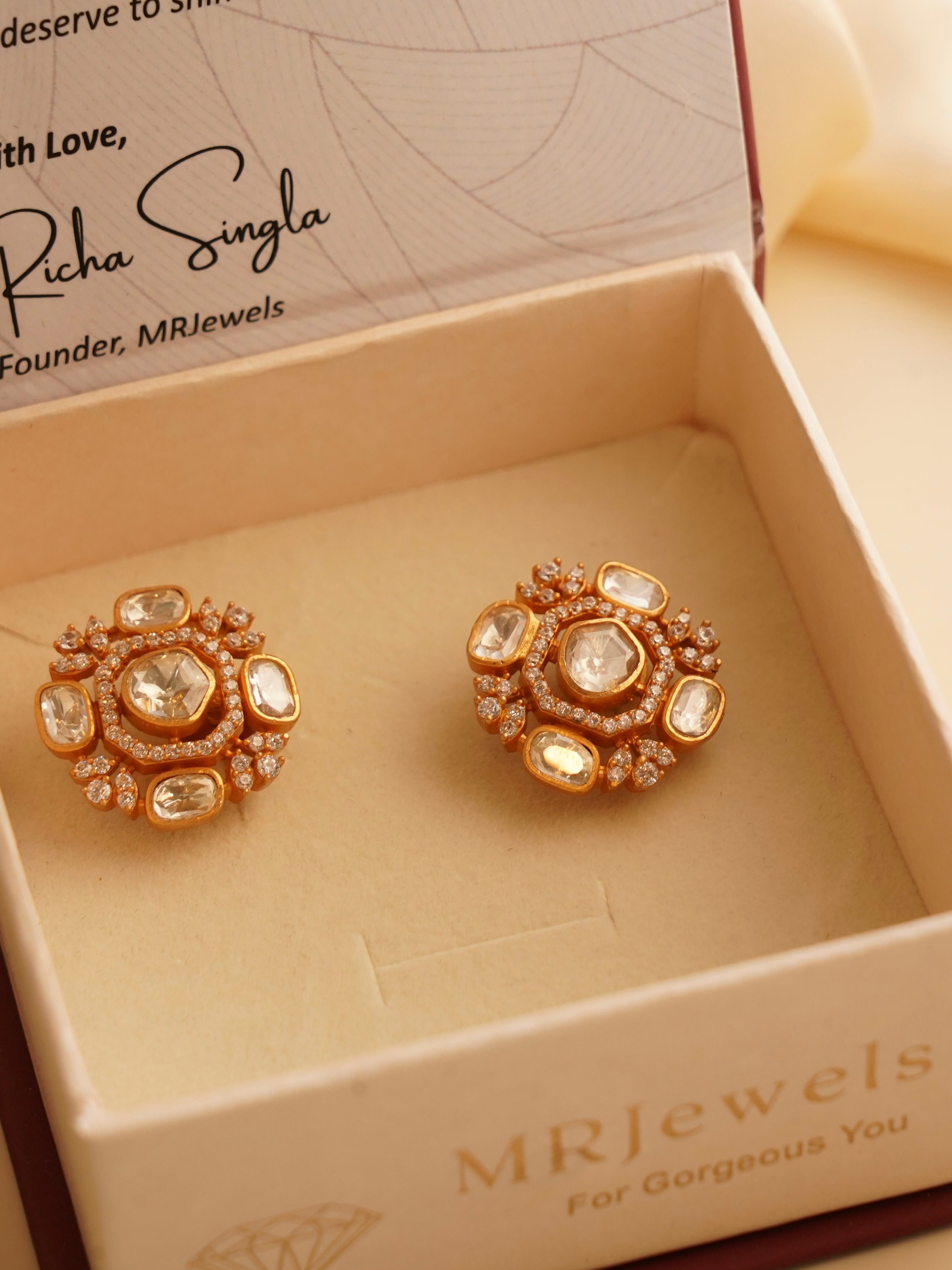 Round moissanite stud earrings with screw-back closure in gold-plated setting