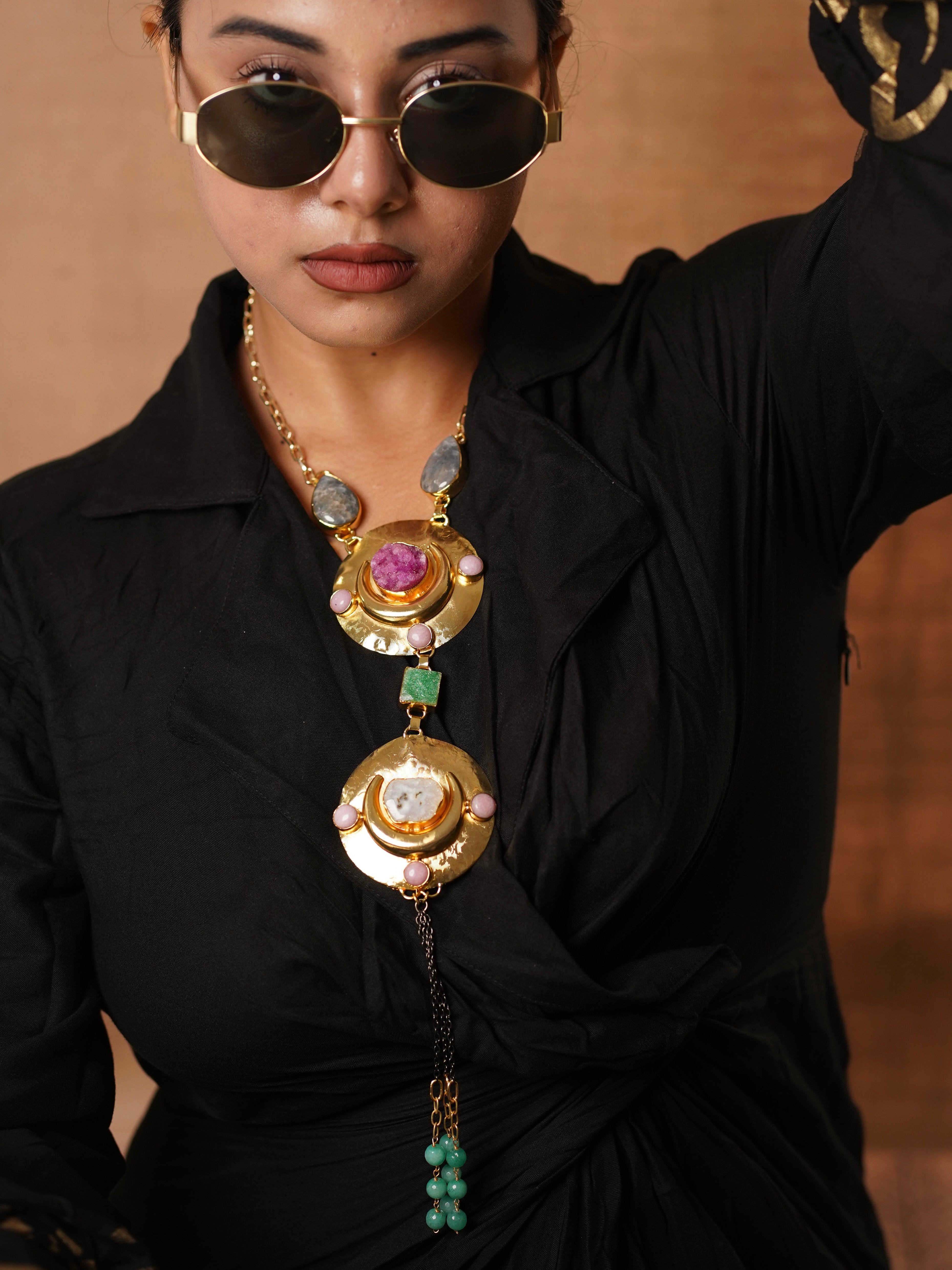 Layered statement necklace with semi-precious stones and celestial-inspired gold medallions