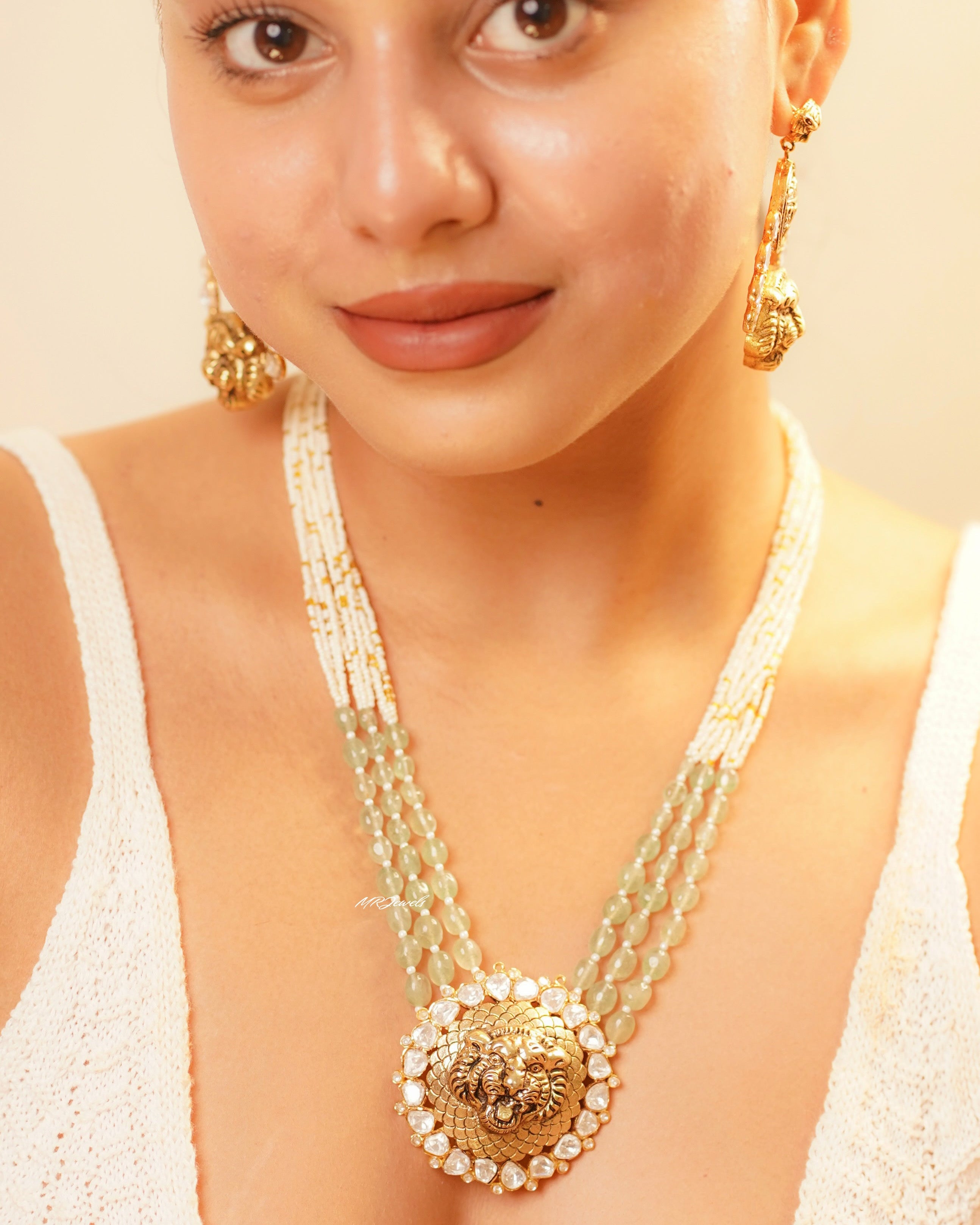 Side angle of imperial kundan necklace highlighting beaded strands and antique gold detailing