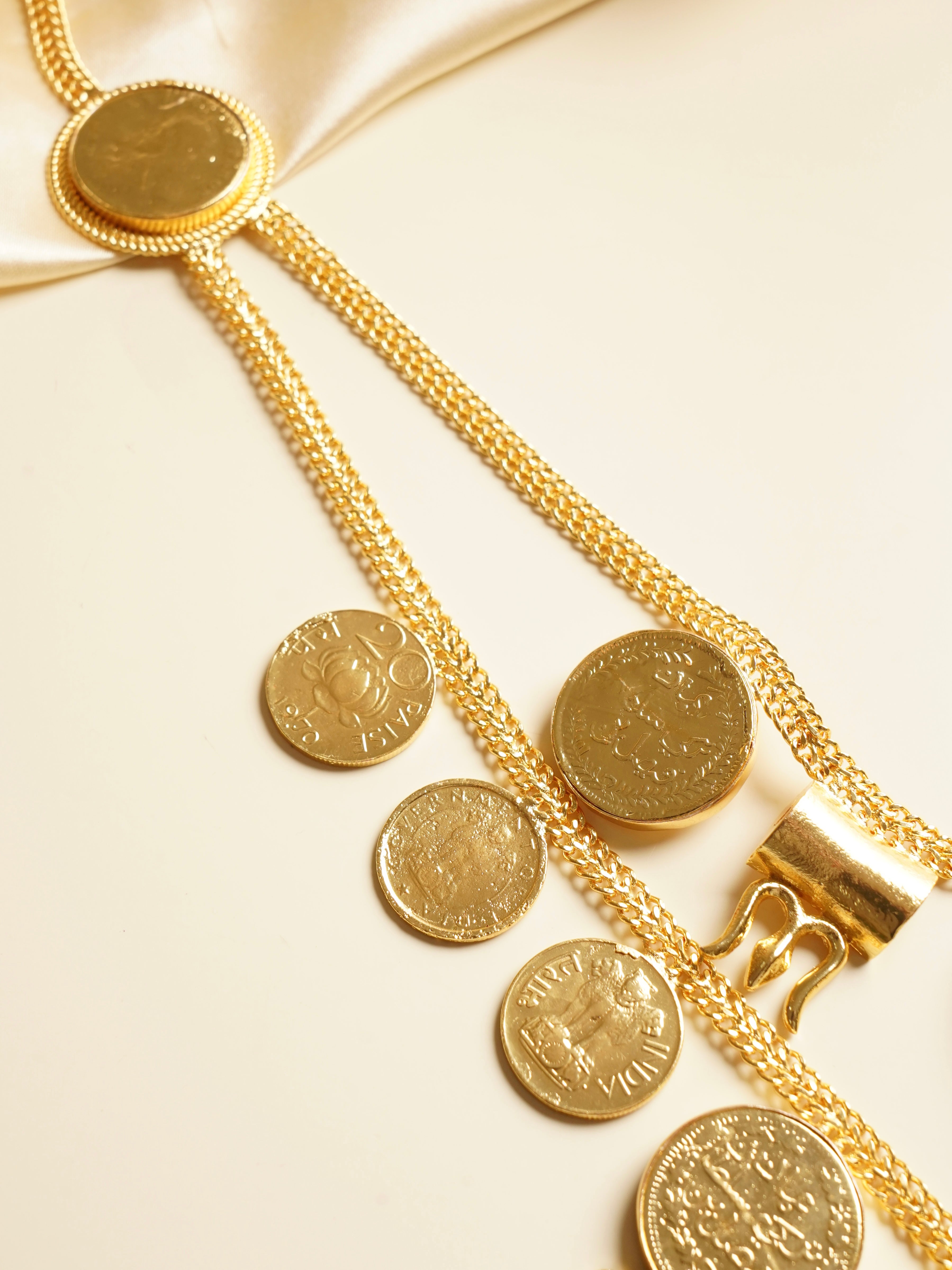 Back view of Zyra necklace showing layered chain structure and bold statement silhouette