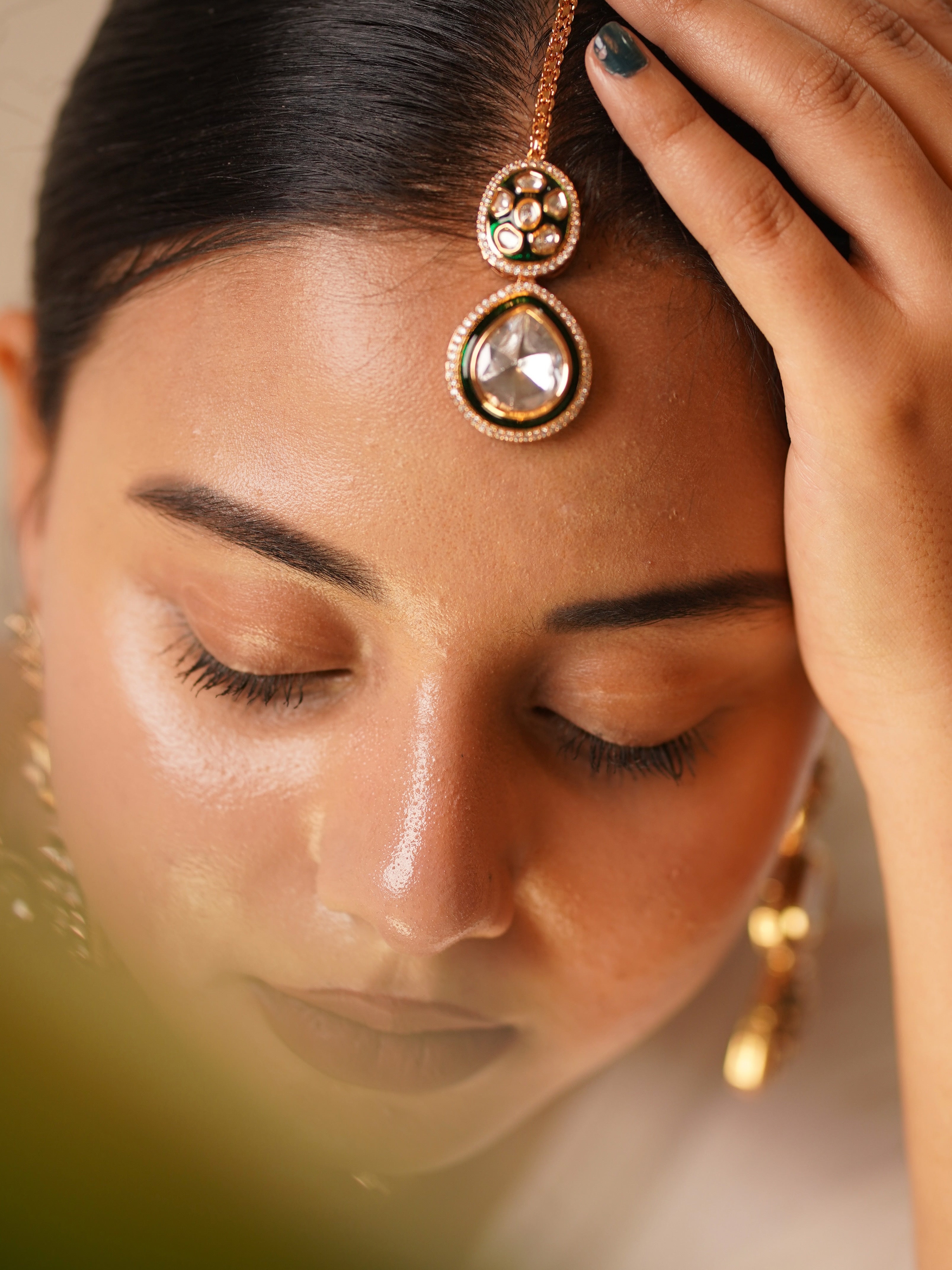 Close-up of heritage-style polki necklace set with green accents and intricate details