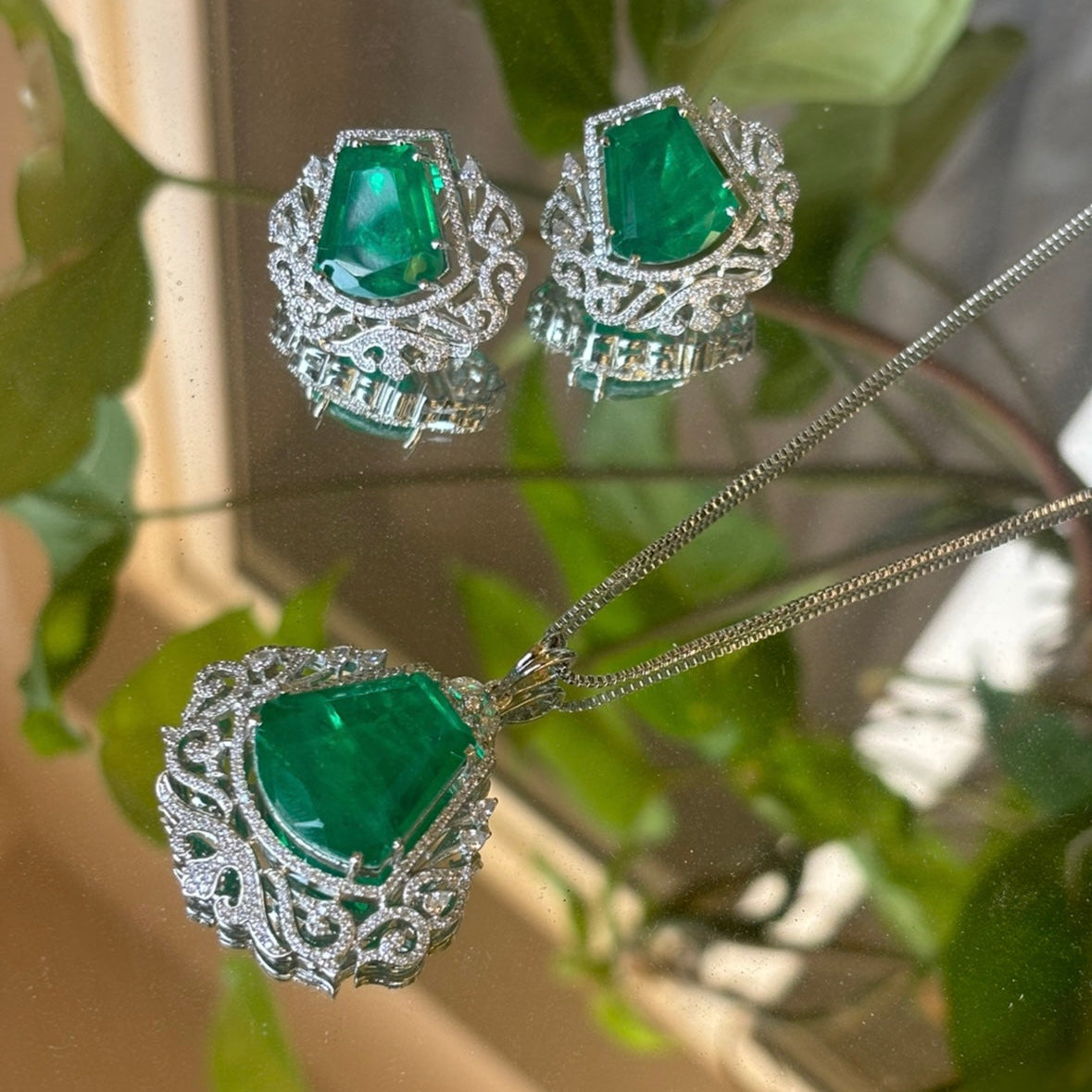 ruby and zircon pendant set in gold plating with teardrop-shaped matching earrings