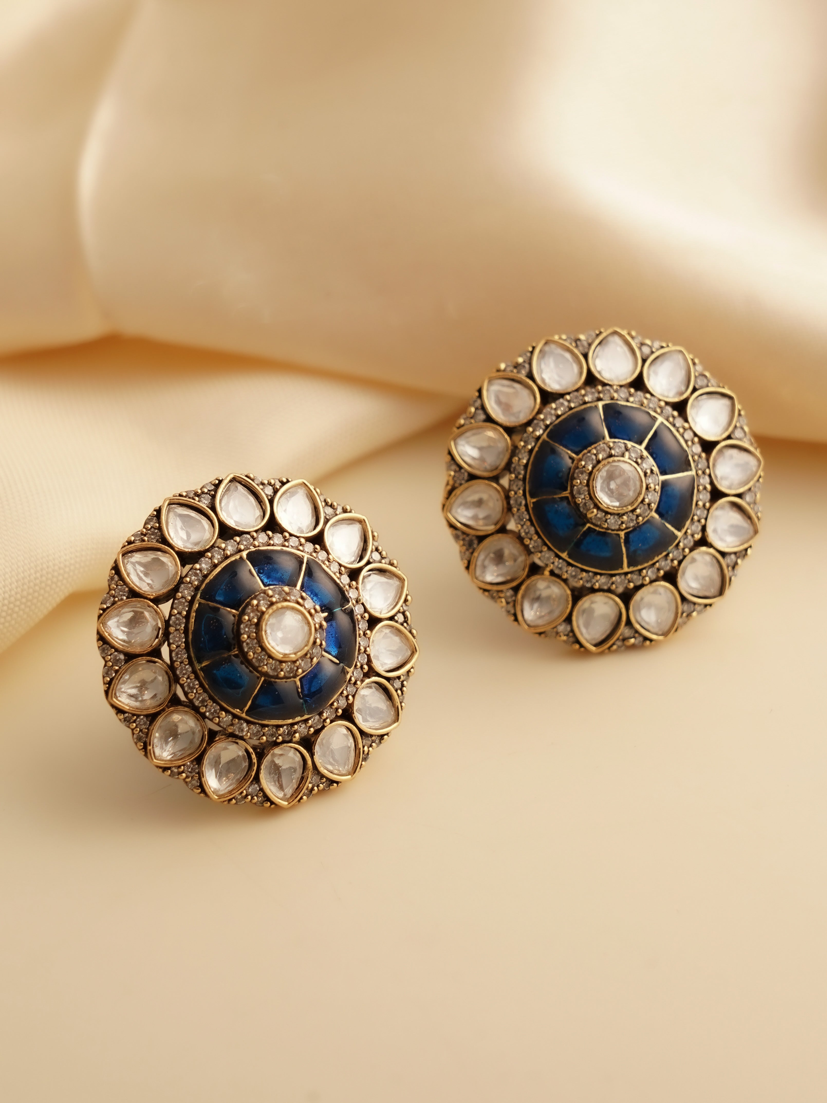 Ruby-centered studs with polki moissanite border in gold tone for a vintage look