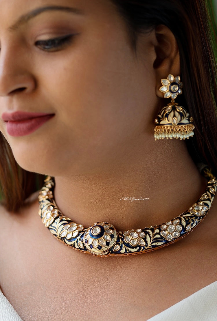 Hasli necklace with meenakari work and matching jhumki earrings in vibrant tones