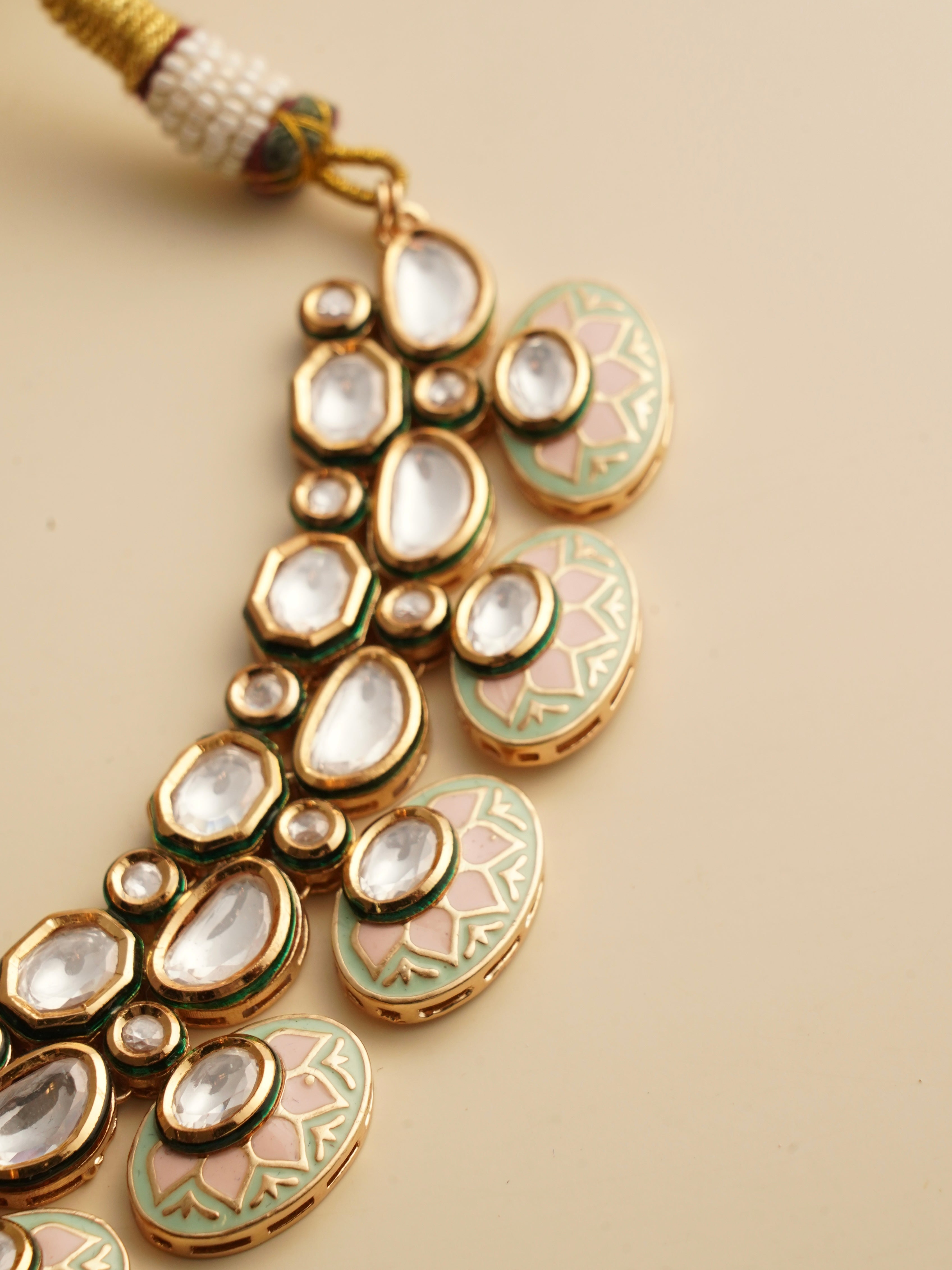 Alternate side view of kundan necklace showing layered design and matching earrings