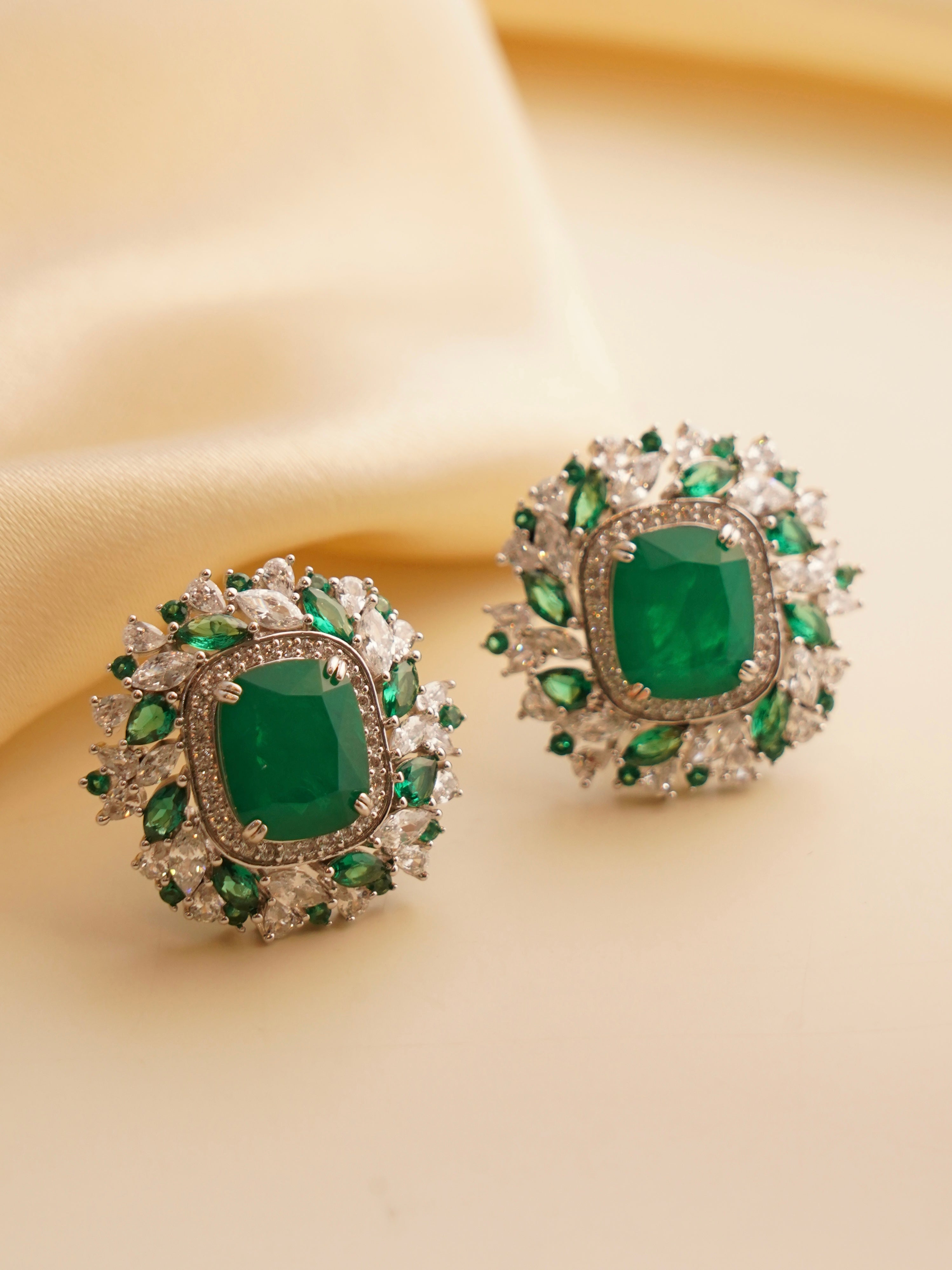 Swarovski crystal studs in ruby red hue with sparkling crystal surround and high-polish finish