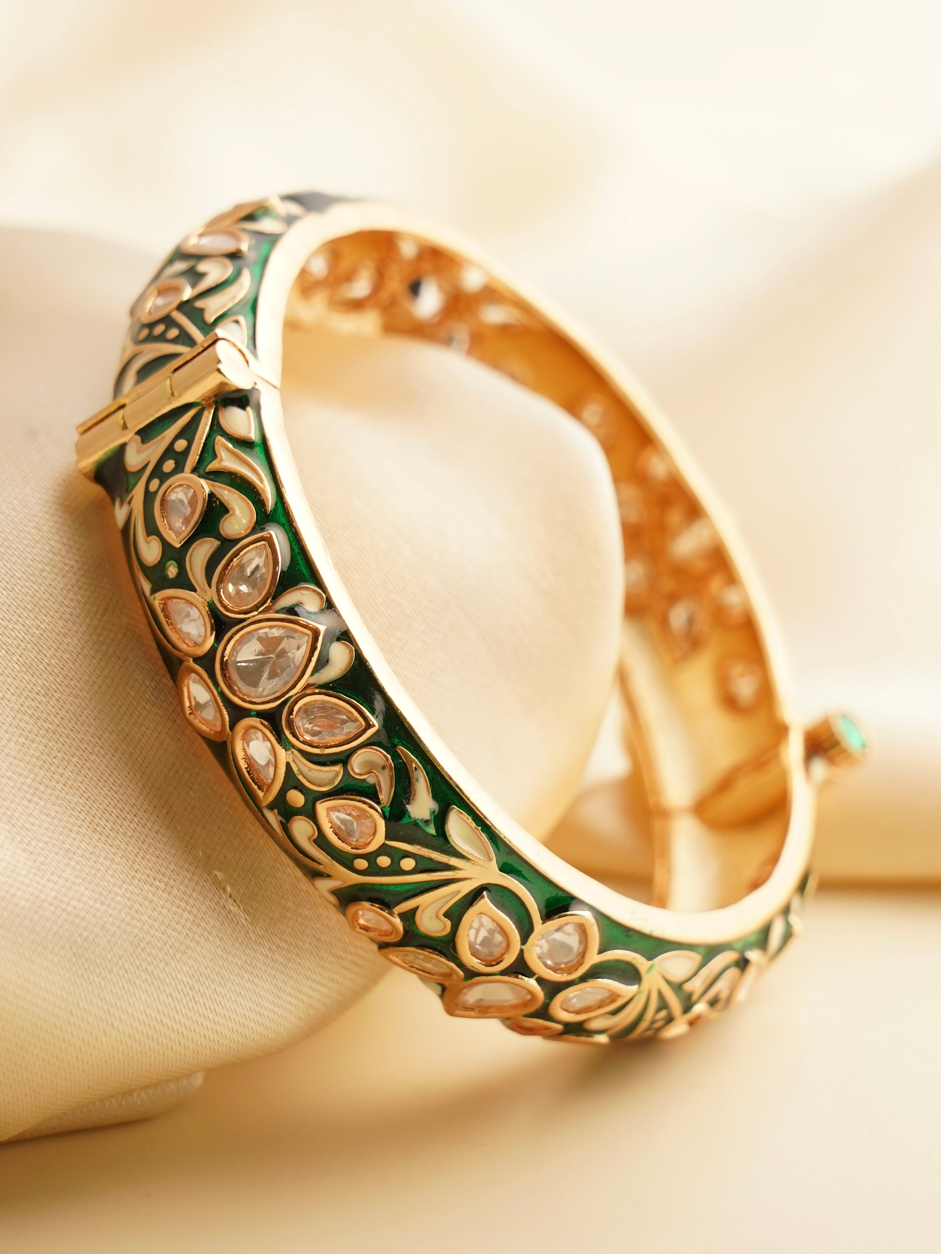 Rear view of kada highlighting enamel design and openable clasp