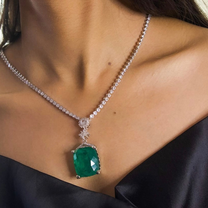 Front view of emerald necklace set with white rhodium finish and diamond simulants