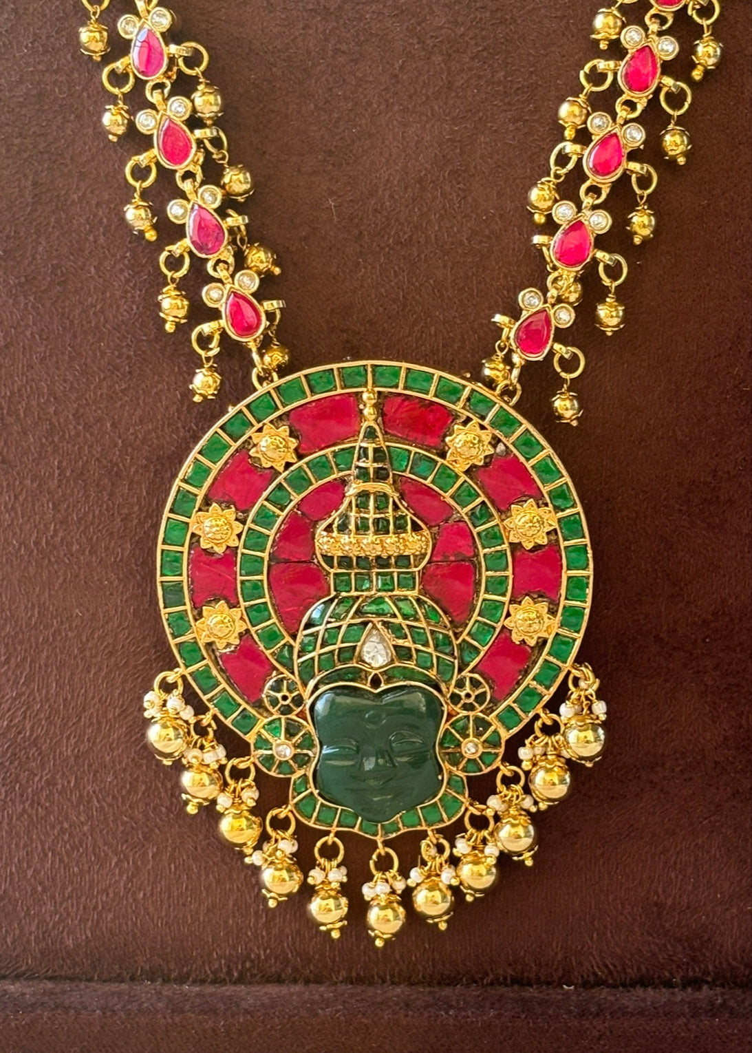 Front view of Kathakali-inspired necklace with intricate detailing and bold stonework