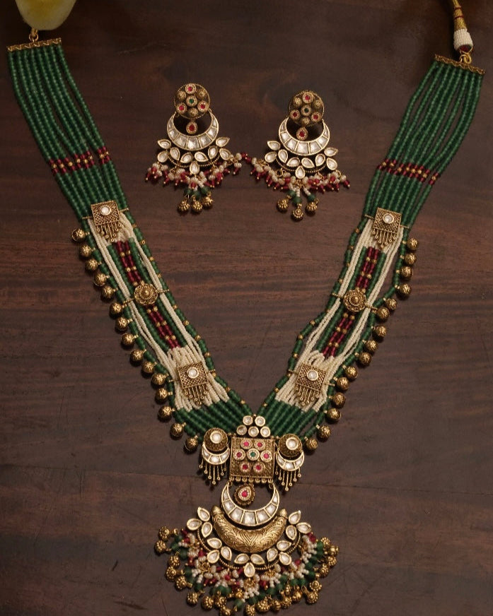 Heritage jewellery set with intricate detailing and matching earrings in traditional style