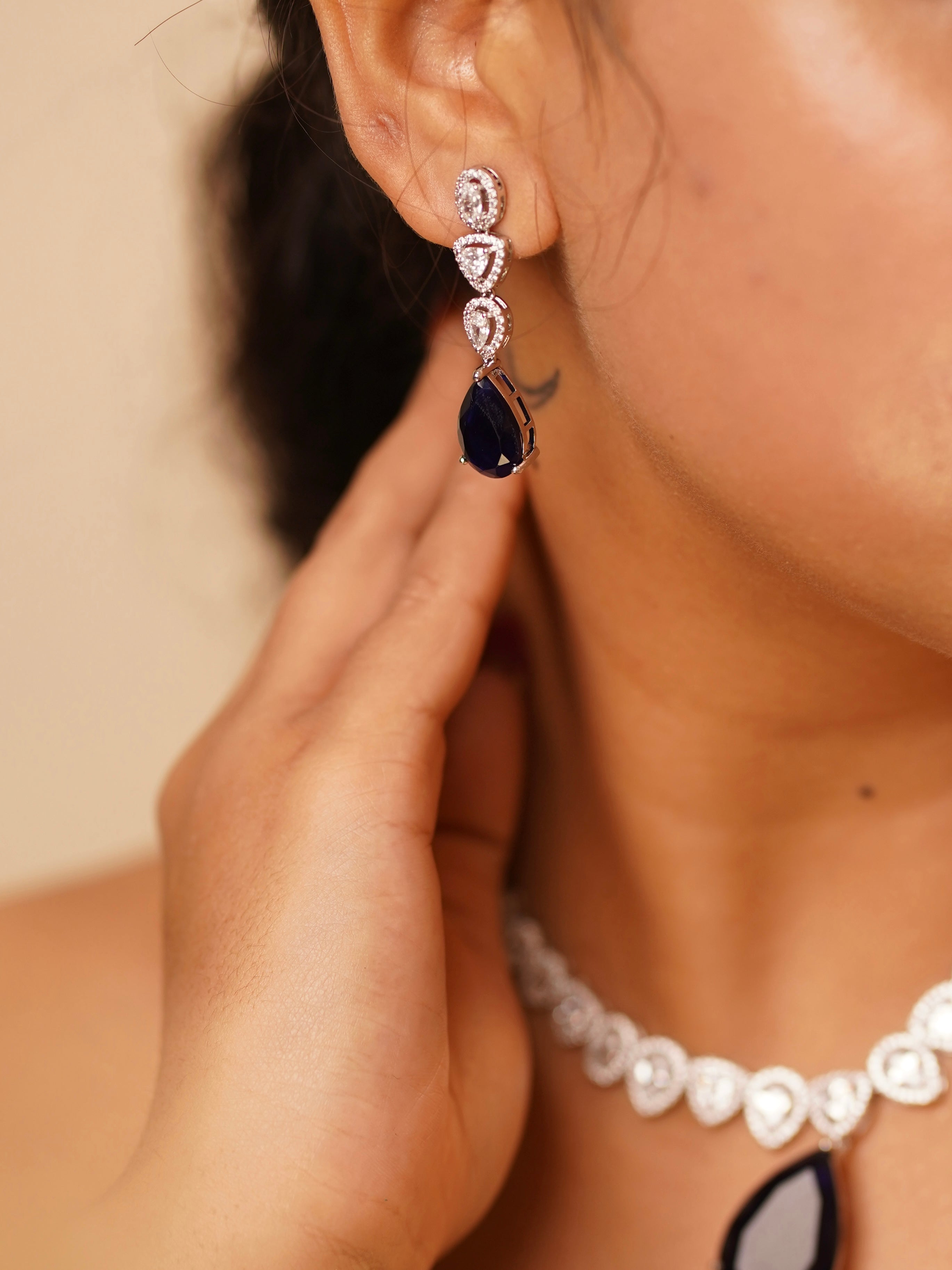 Full view of luxe yellow diamond set with matching earrings and halo design