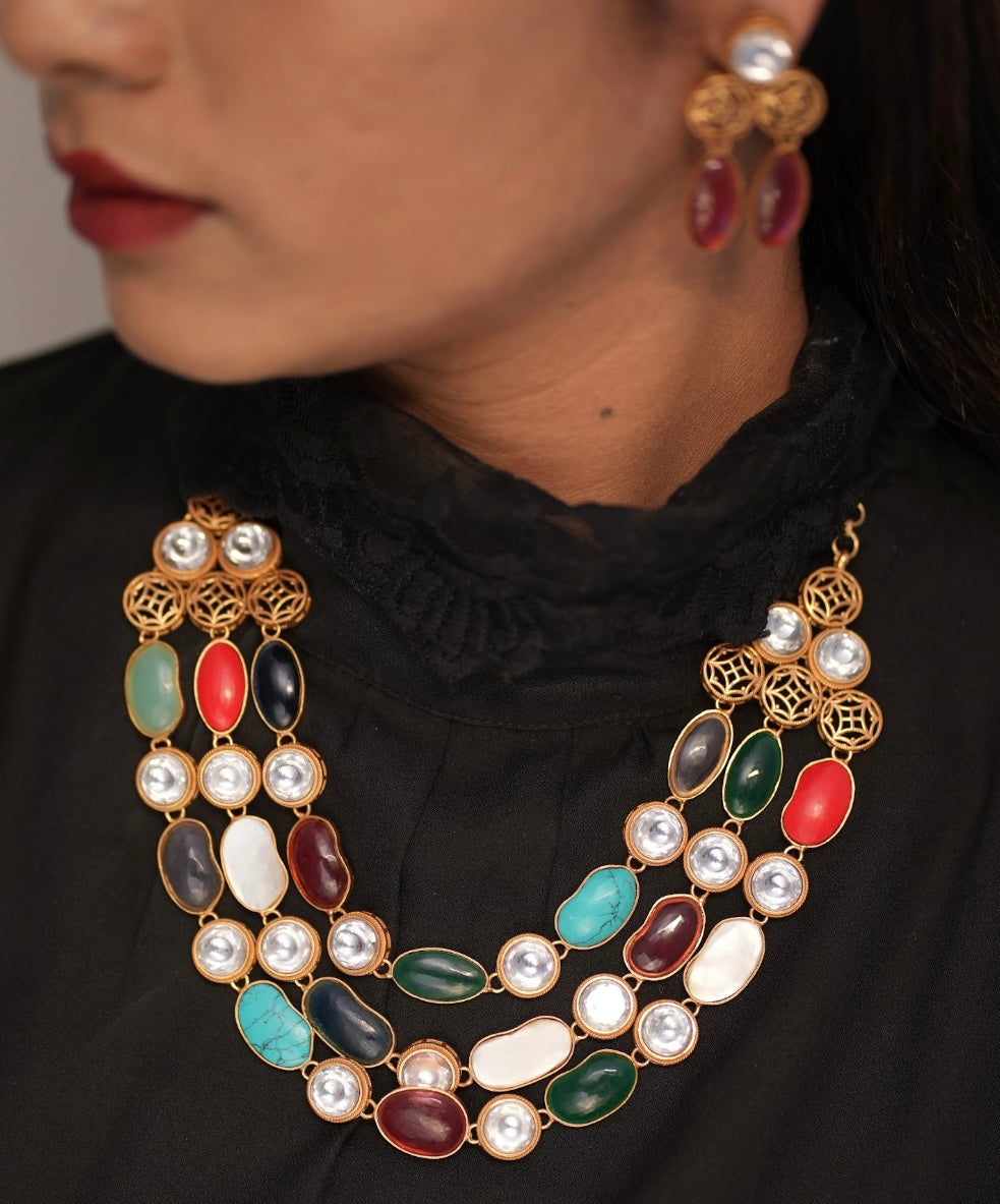 Side angle of semi-precious necklace highlighting multi-layer design and natural tones