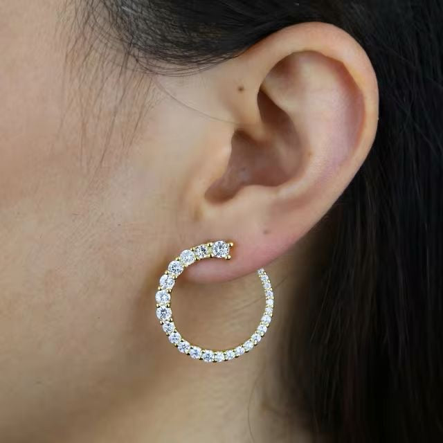Front view of trendy gold-plated hoops with clean circular shape and minimalist style