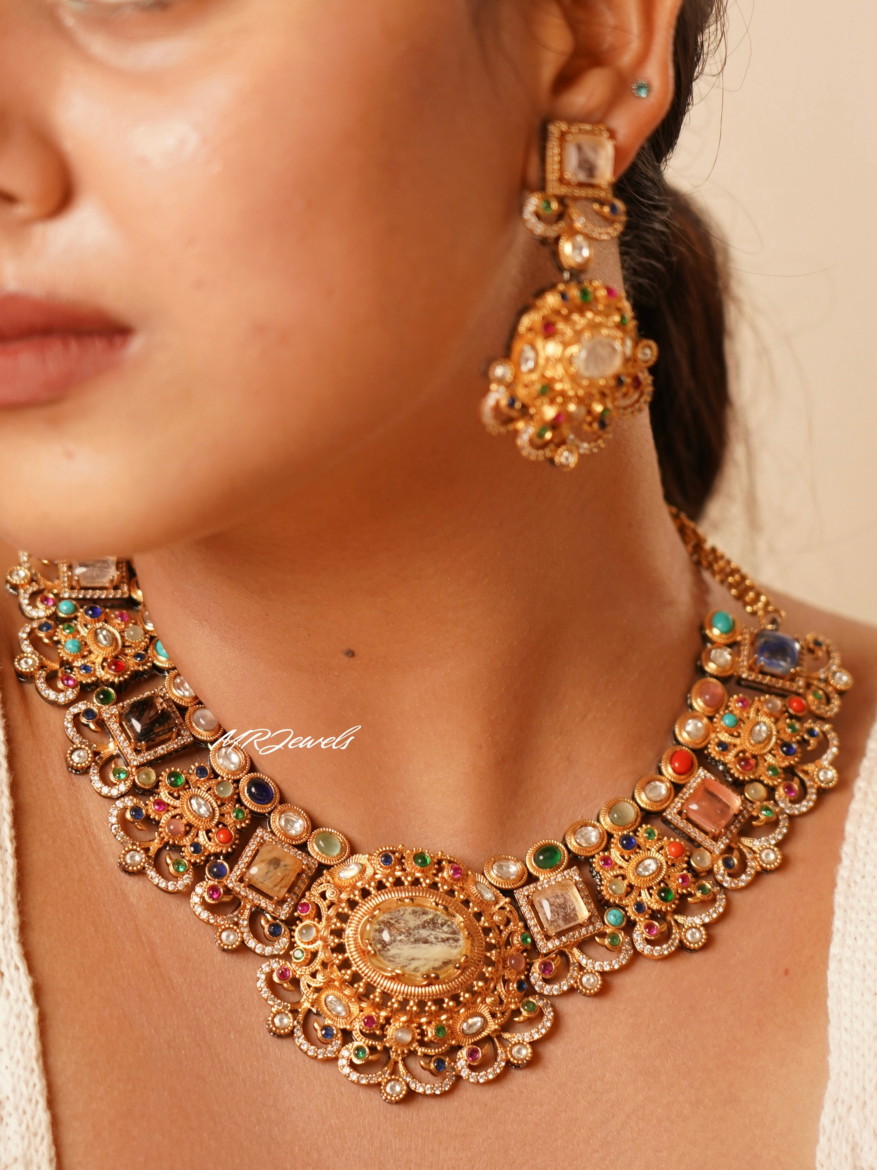 Close-up of sabyasachi-inspired necklace with statement stones and intricate gold detailing