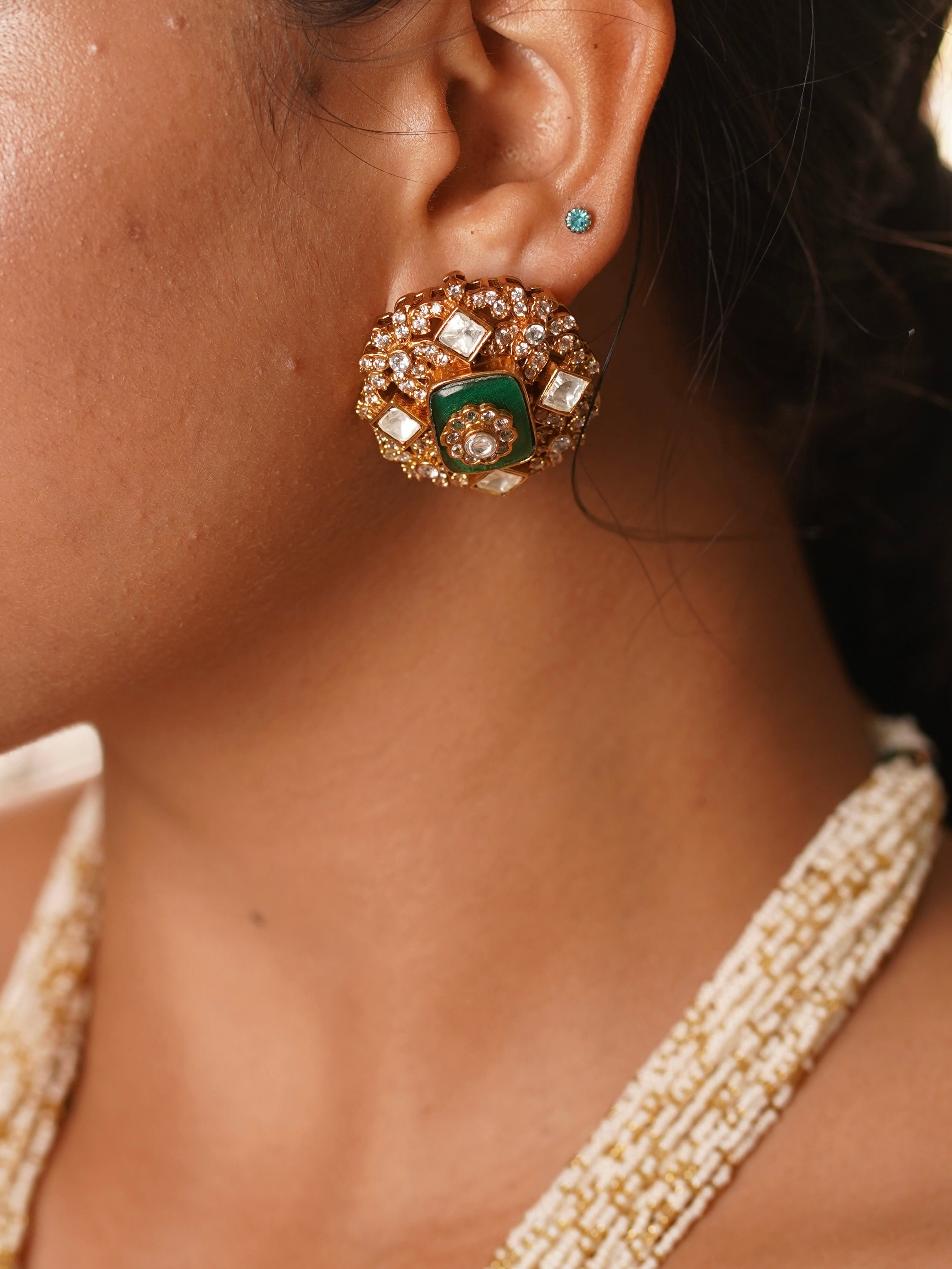 Layered view of radhika necklace set with kundan pendant and pearl strings for regal styling