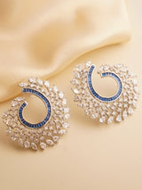 Spiral earrings with multicolored baguette stones in swirl design featuring ruby, emerald, and sapphire hues