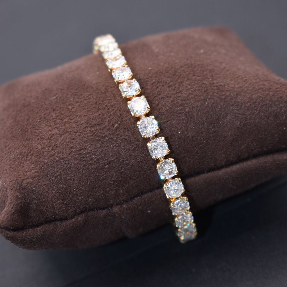 Close-up of tennis bracelet with symmetrical round stones in polished setting