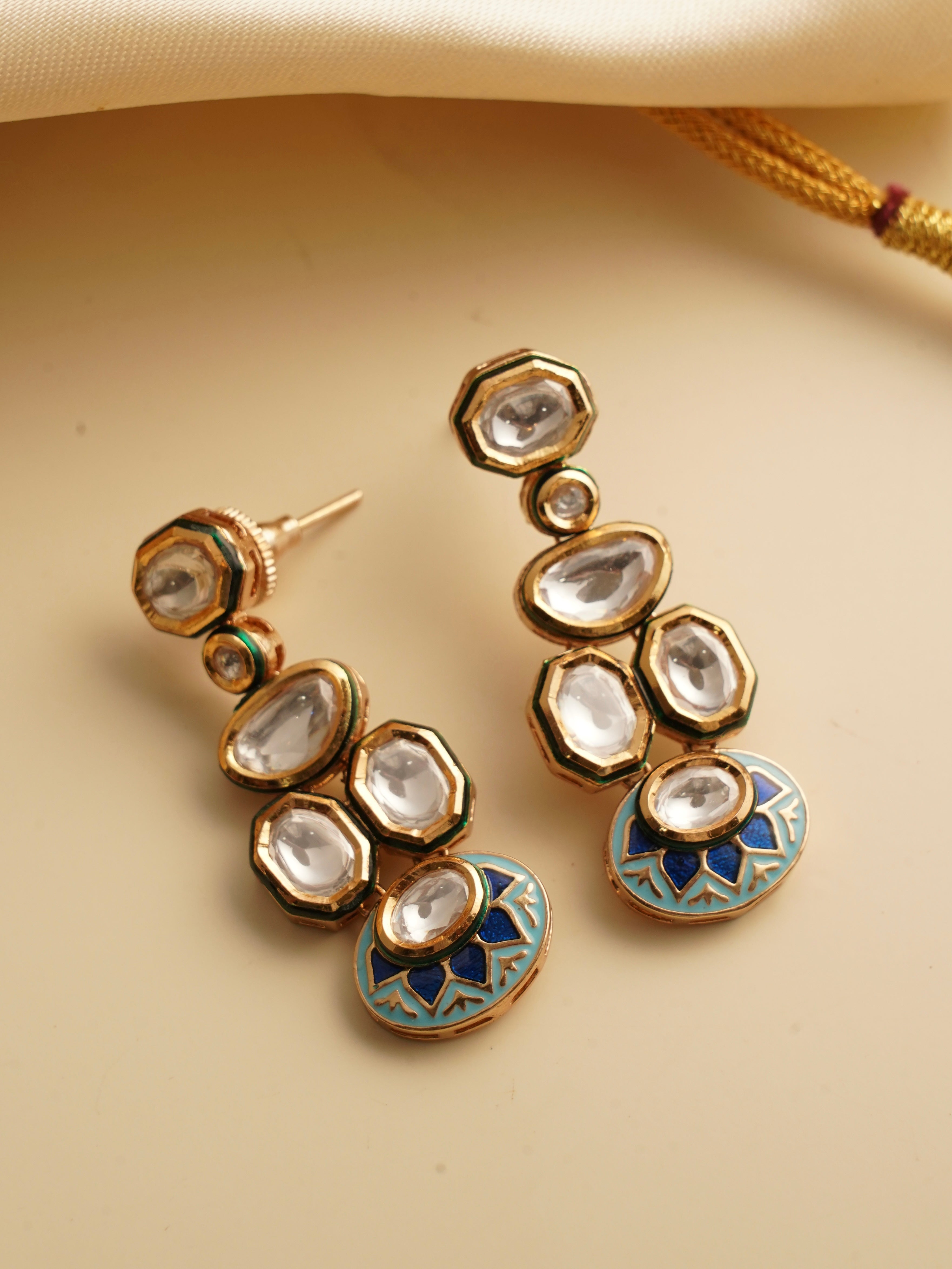 Close-up of kundan necklace set highlighting detailed meenakari and gemstone work