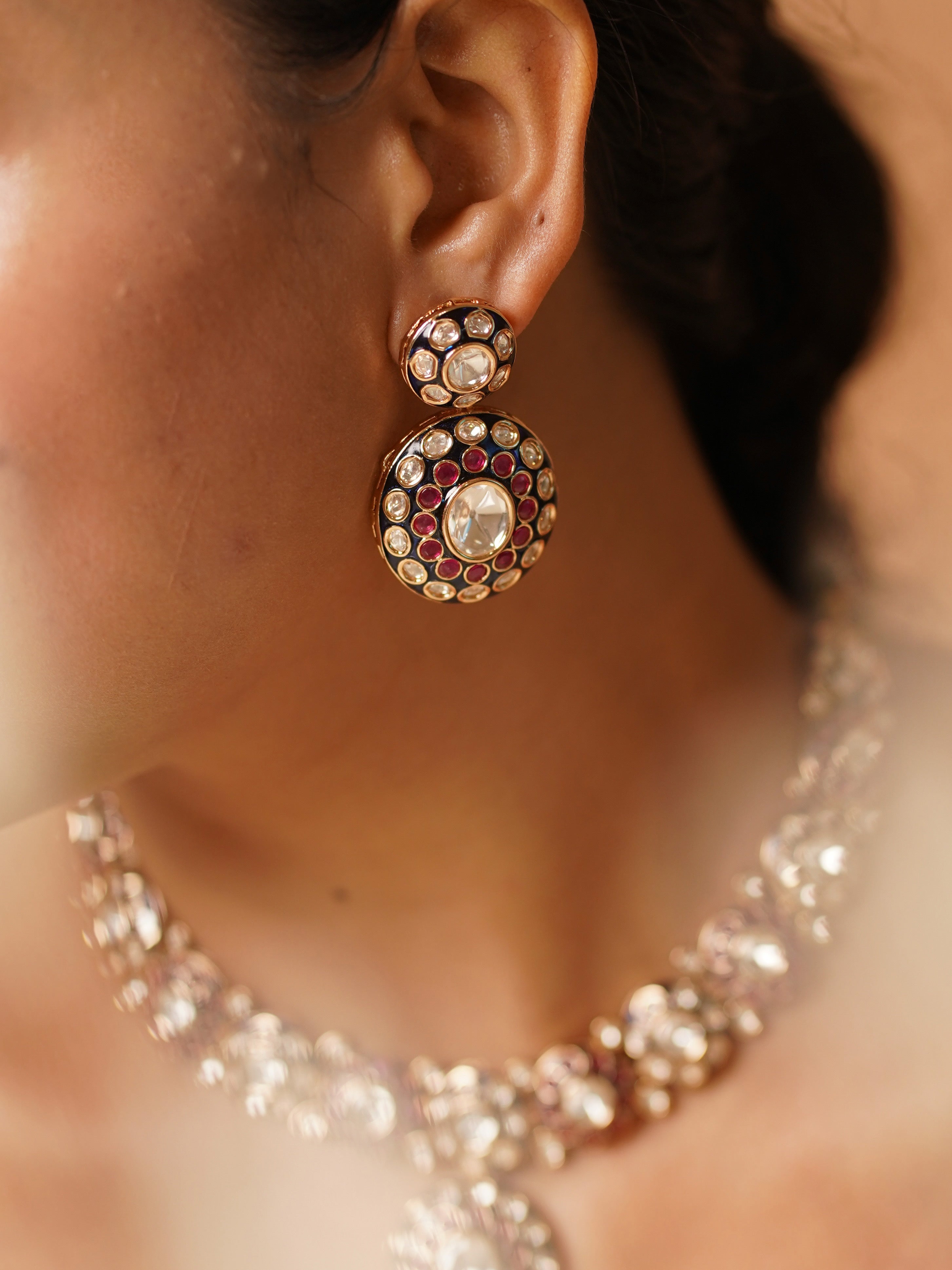 Close-up of meenakari kundan necklace highlighting rich enamel and gold-plated design