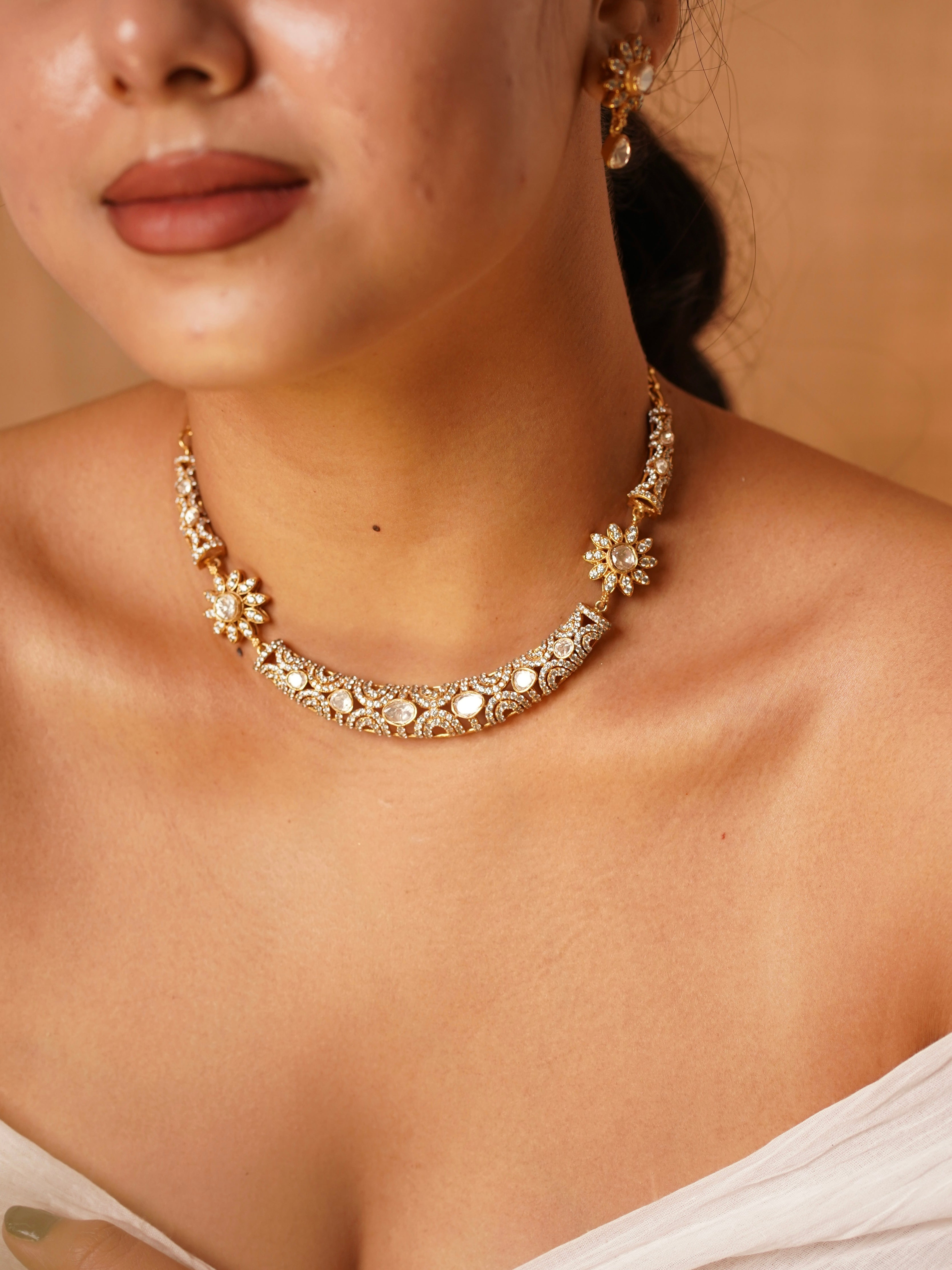 Close-up of Aarohi floral kundan choker showcasing kundan stones, intricate floral motifs and pearl accents