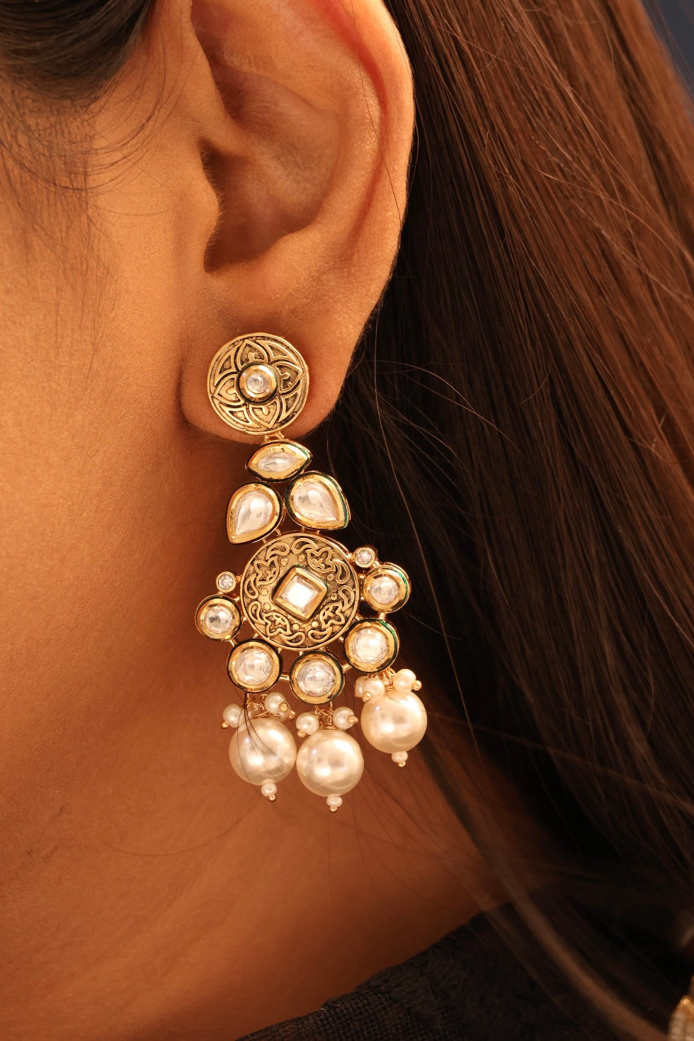 Close-up of layered pearl necklace showcasing kundan pendant and intricate detailing