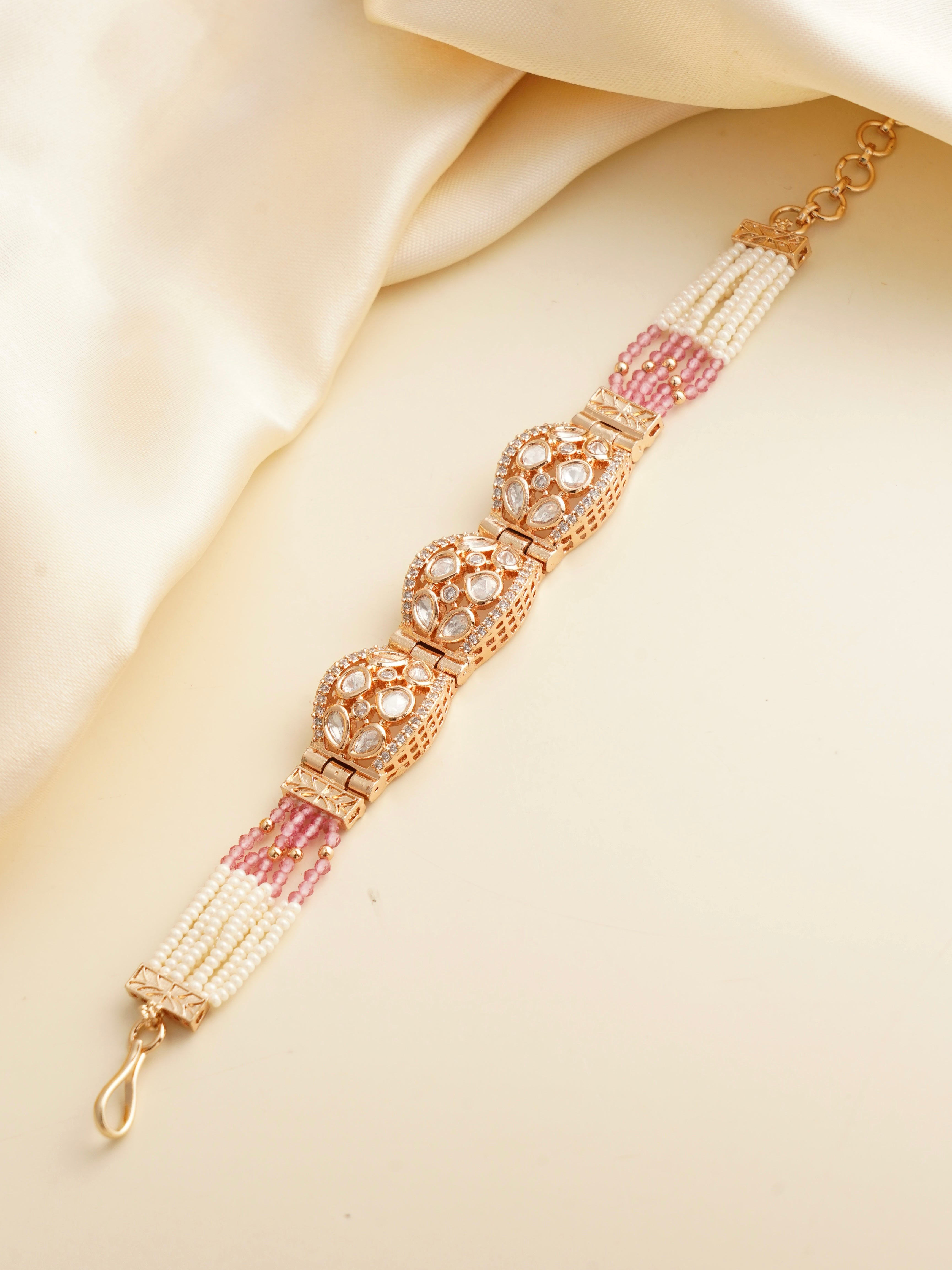 Polki dome bracelet featuring uncut stones, pearl strands and baby pink bead accents