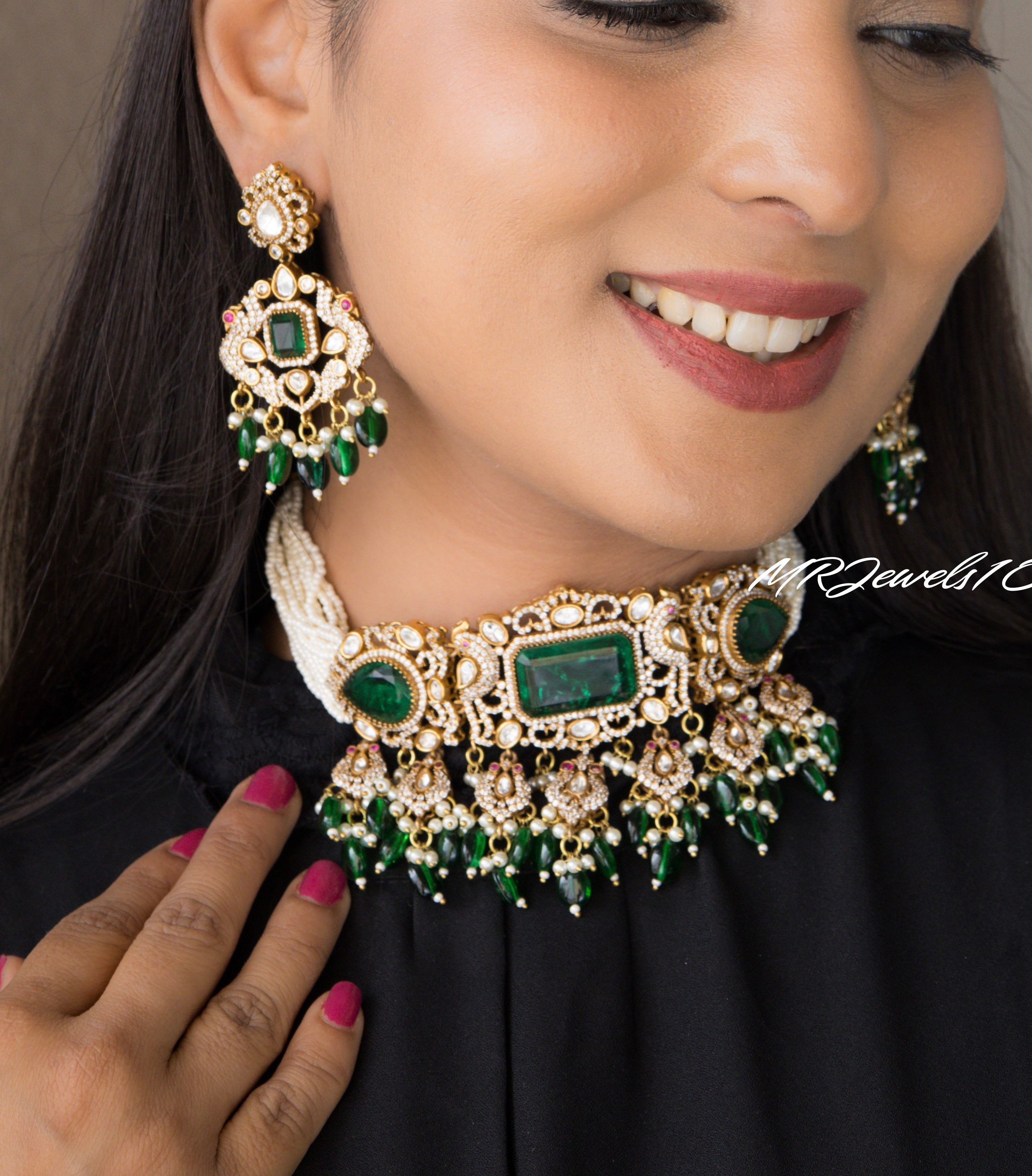 green kundan choker with peacock motif design and matching earrings in brass