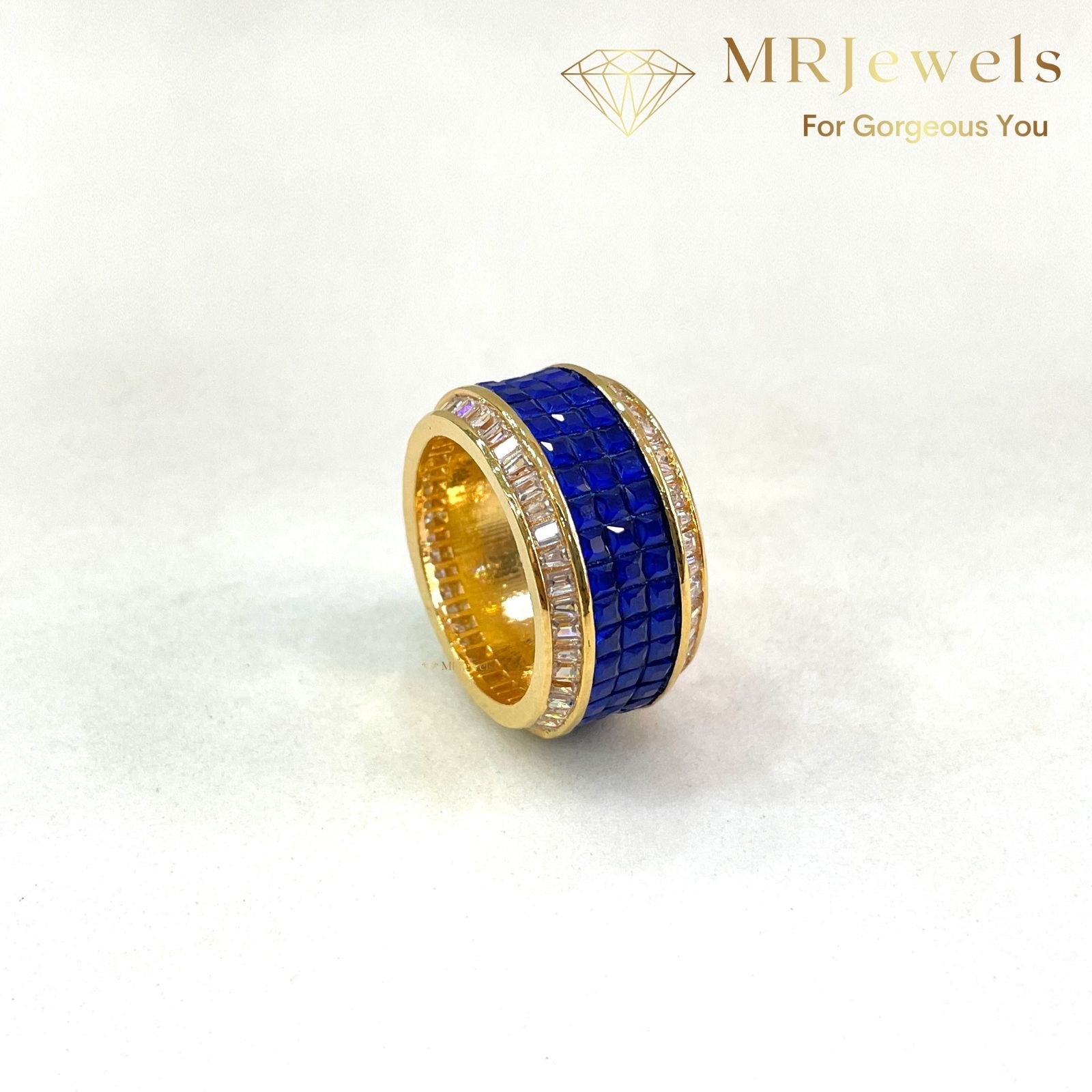 Sapphire diamond band with emerald row and baguette diamonds in gold plating
