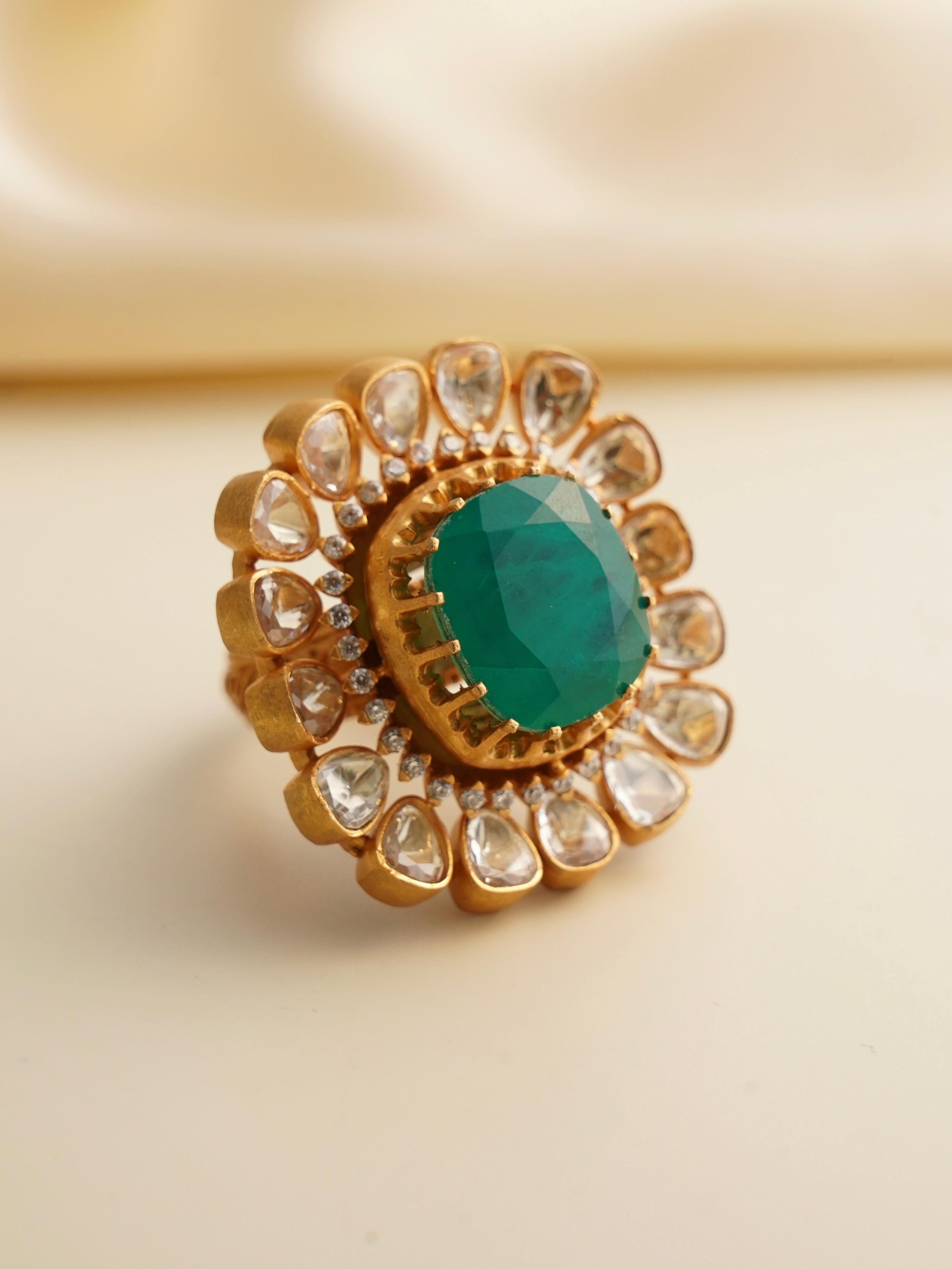 Side profile of bold moissanite ring with gold-plated finish and stone detailing