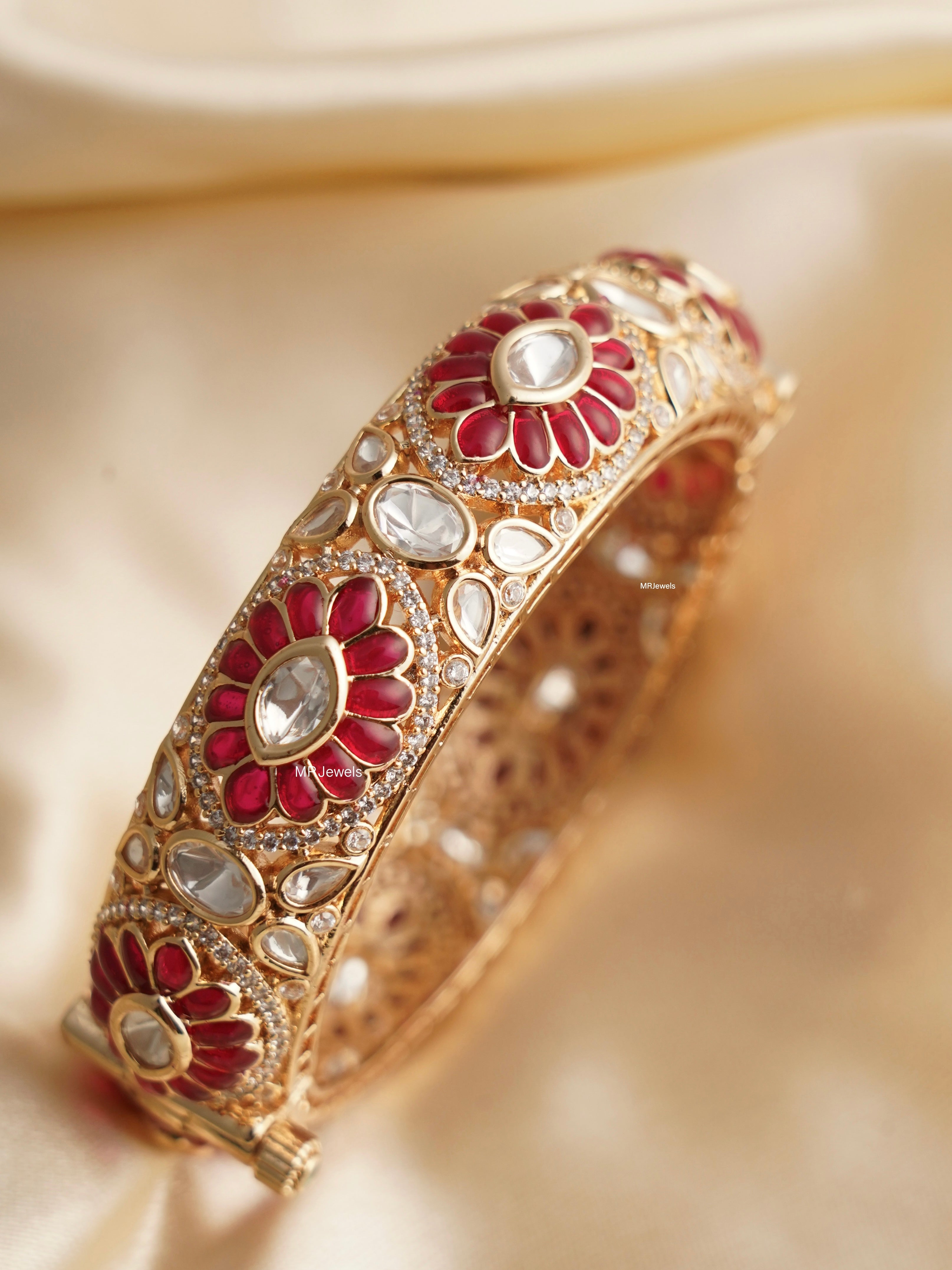Close-up of gold-polished kada bangle with polki stones and openable clasp