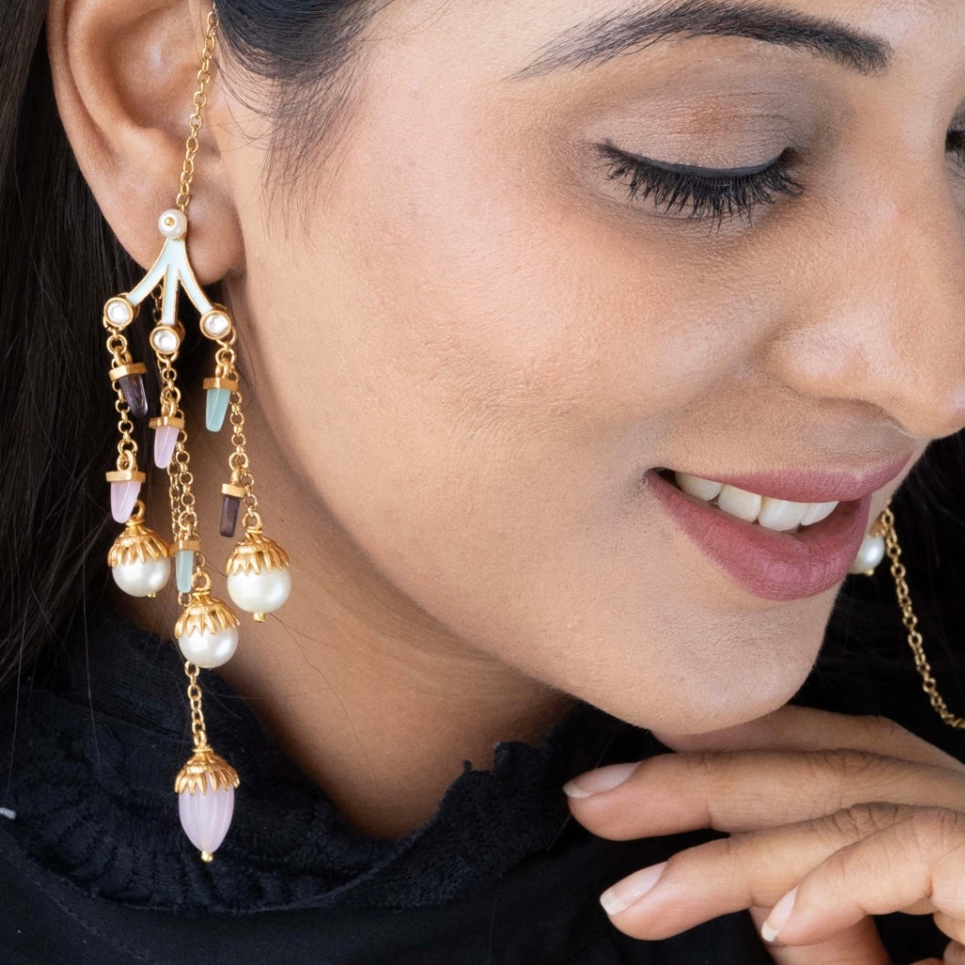 Long statement earrings featuring layered pearl bead chains, frontal view