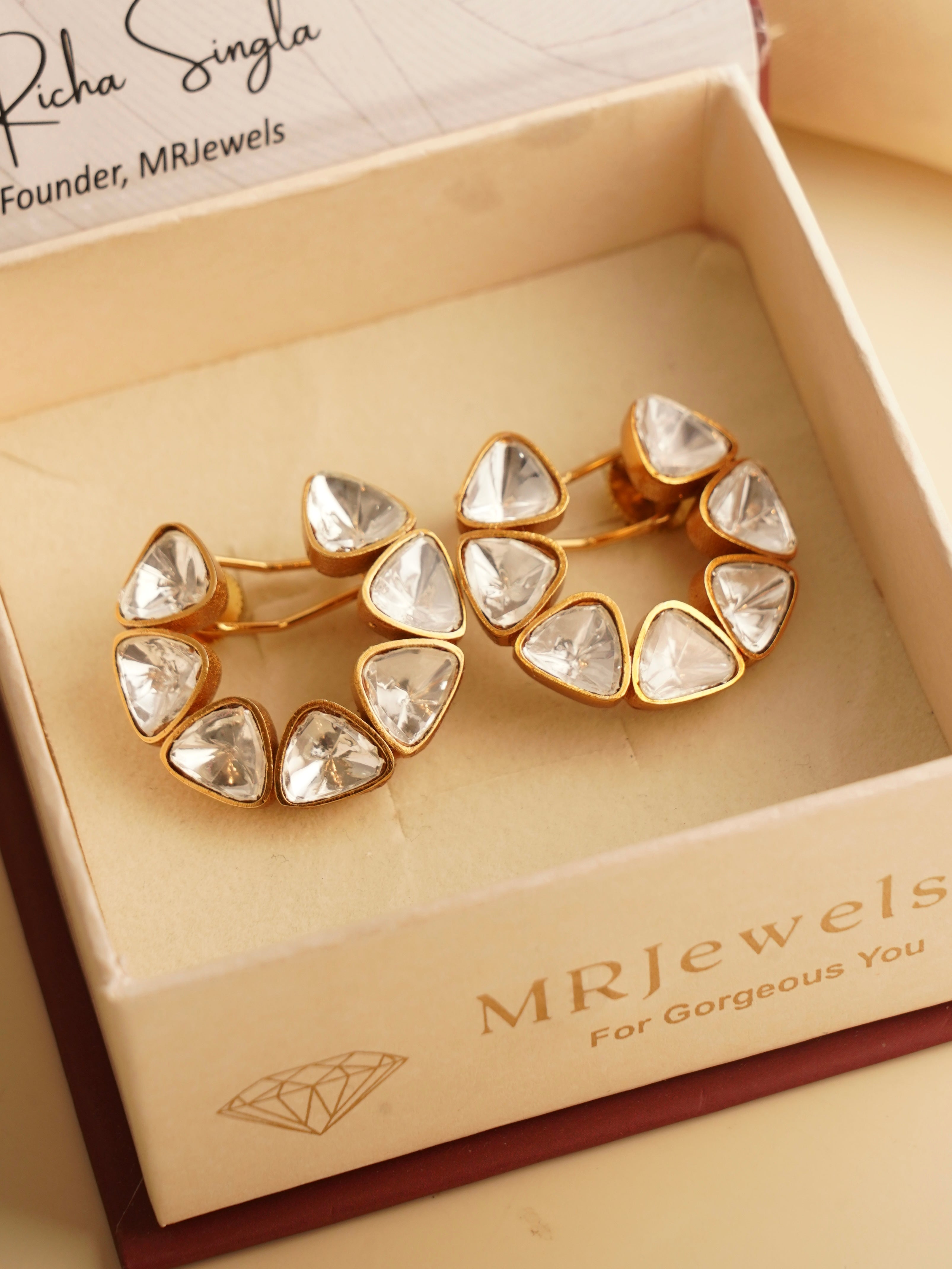 Close-up of uncut polki earrings showcasing natural uncut stones