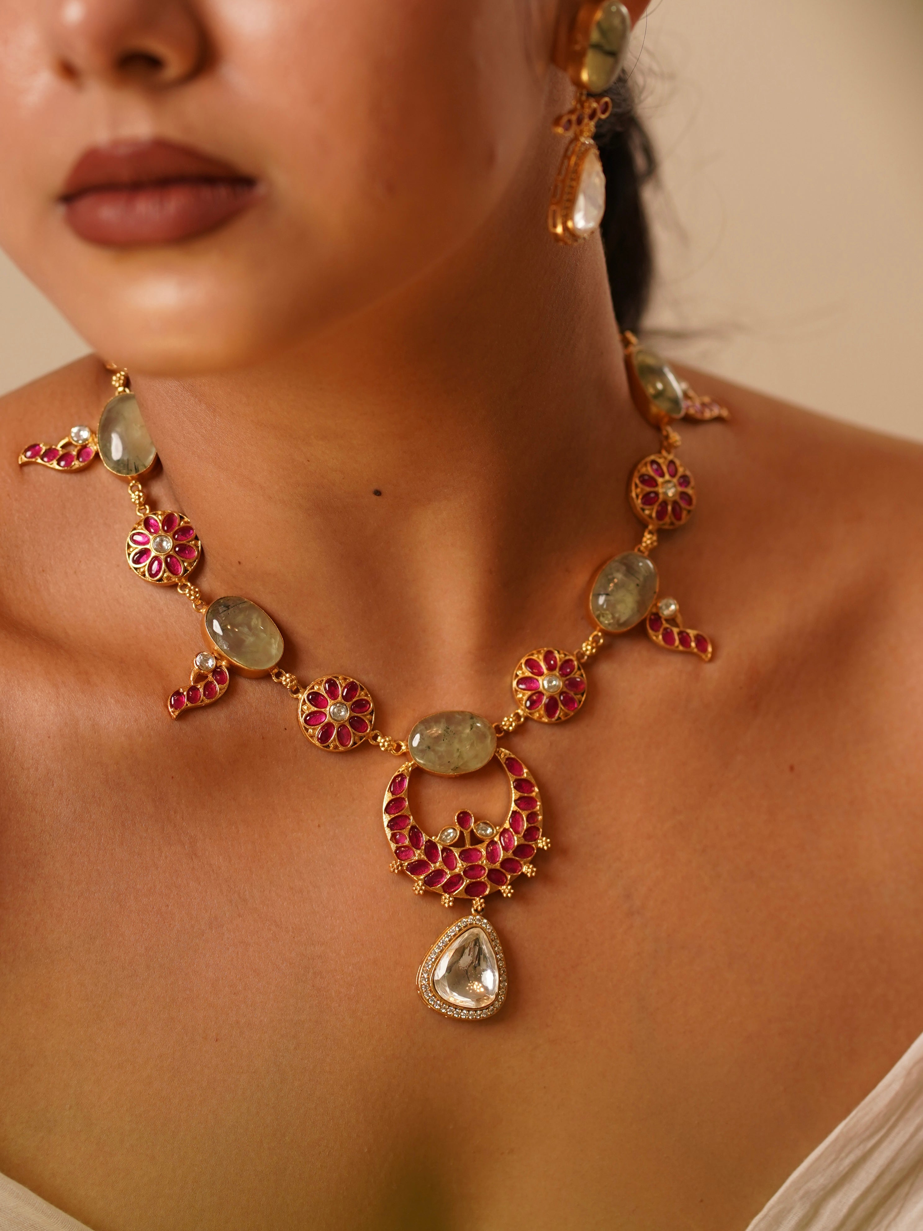 angled view of handcrafted kempu necklace set with traditional gemstone work