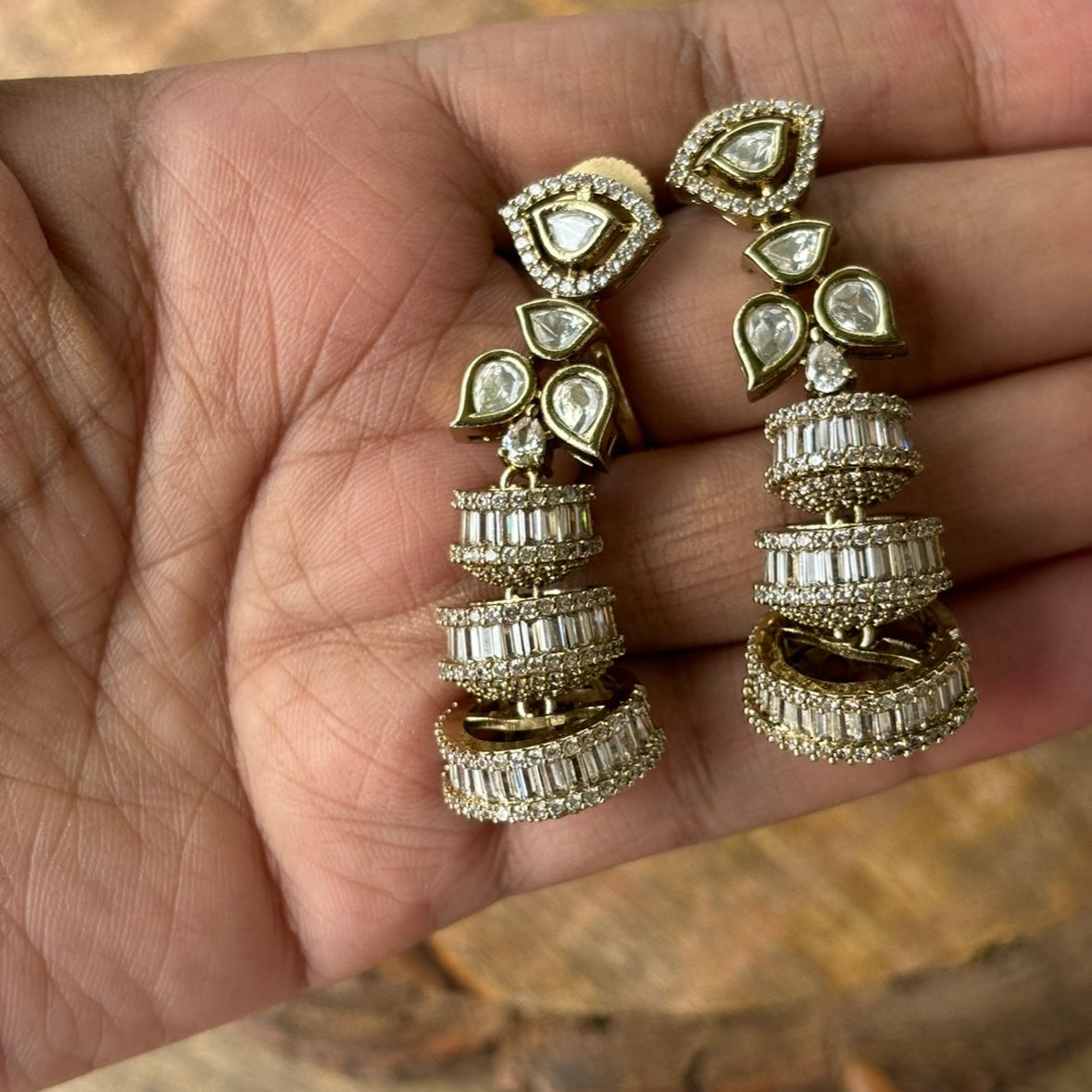 Side angle of Alina earrings showcasing layered baguette and stone detailing