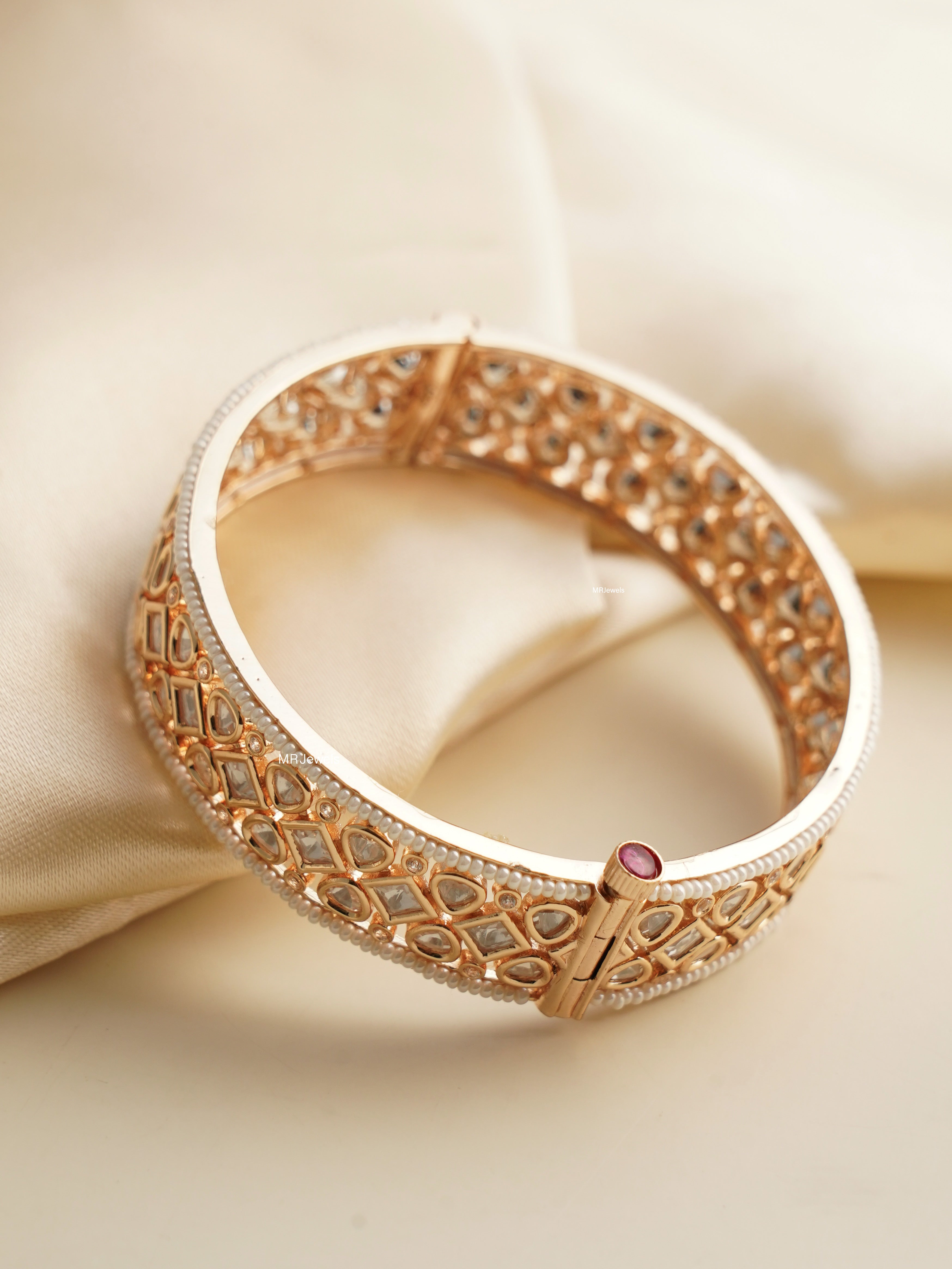 Side view of slim polki bangle with textured gold-toned plating