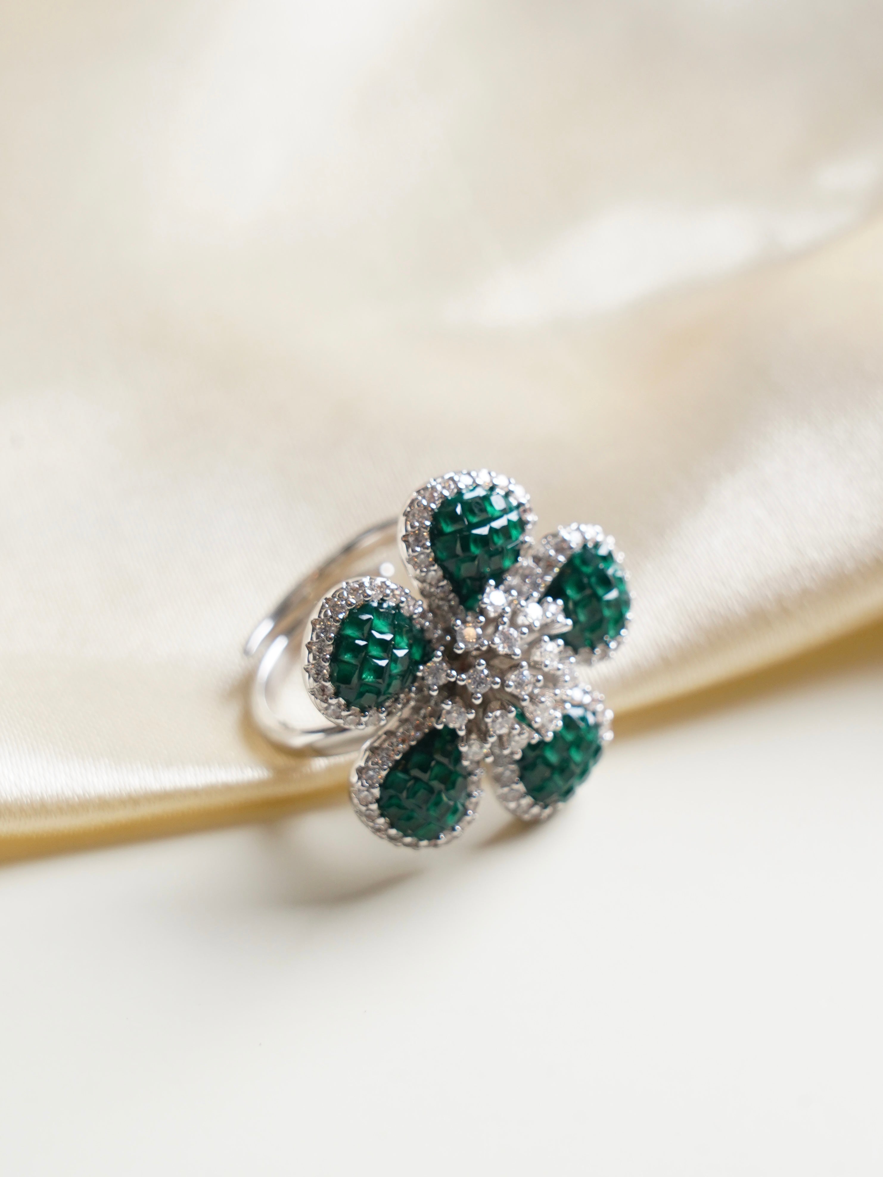 angled close‑up capturing layered baguette set petals of luxe mosaic floral cocktail ring