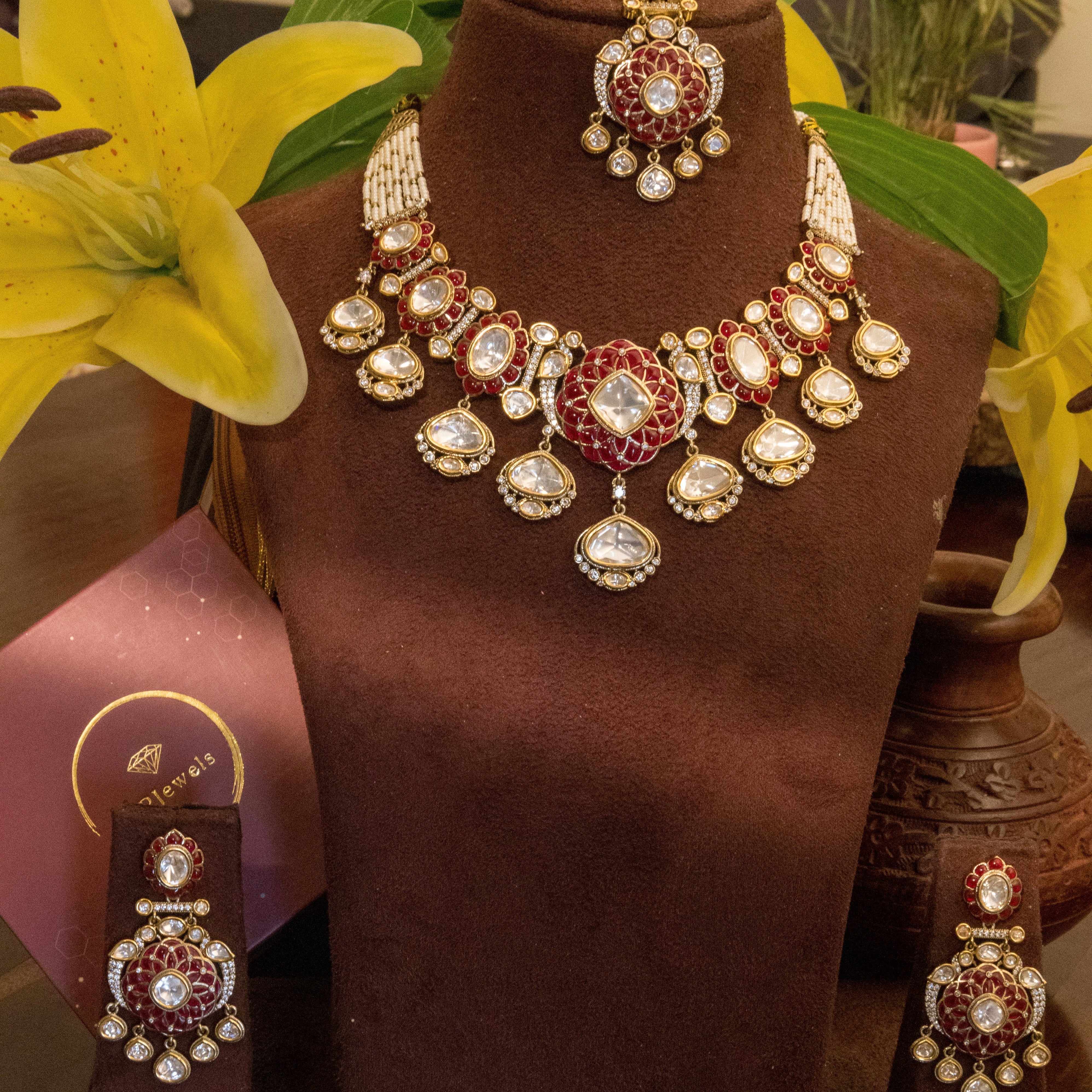 Mughal-style polki kundan necklace with green enamel and pearl tassels