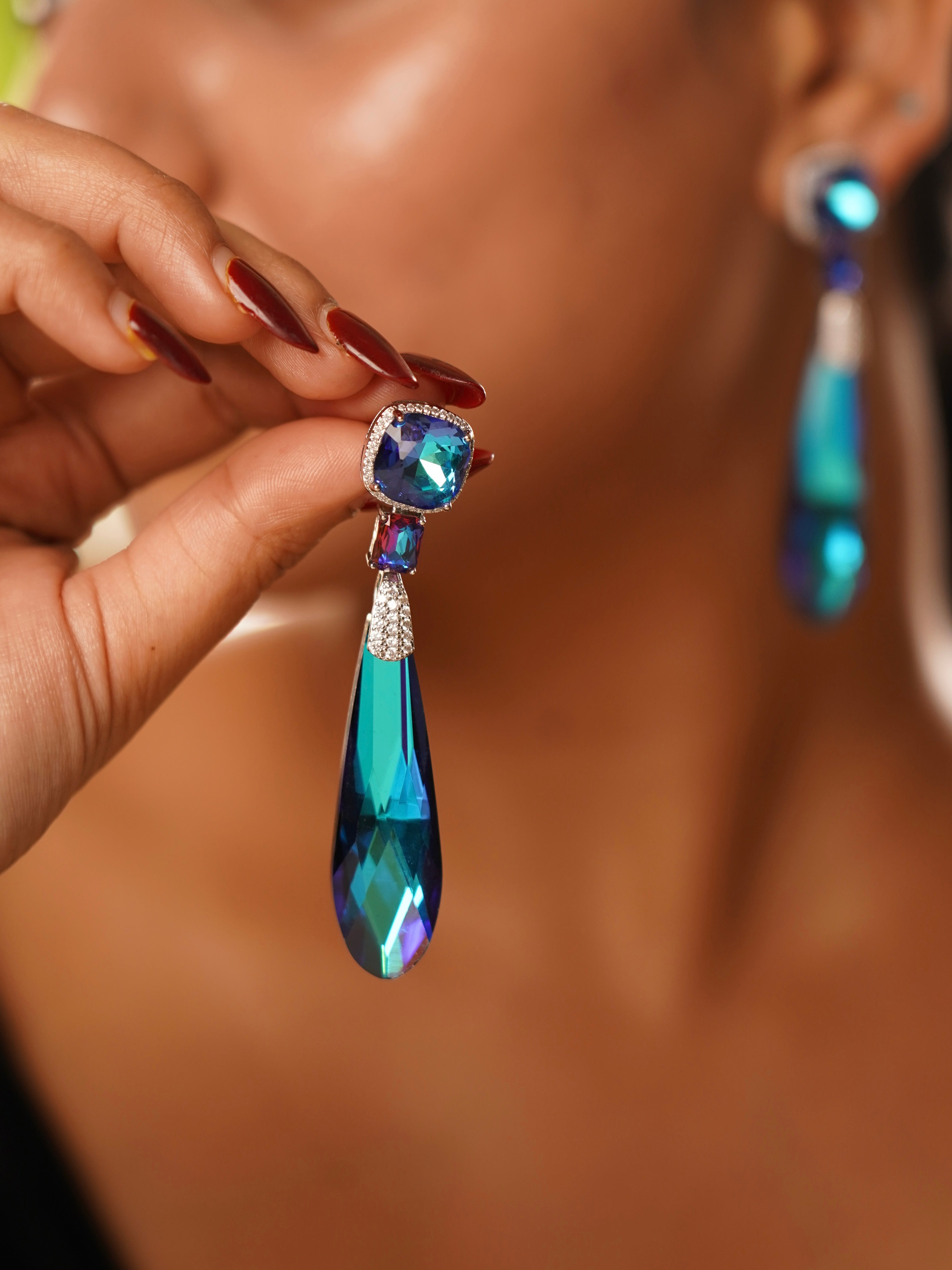 Crystal prism drop earrings in golden amber and iridescent tones with silver finish and CZ accents