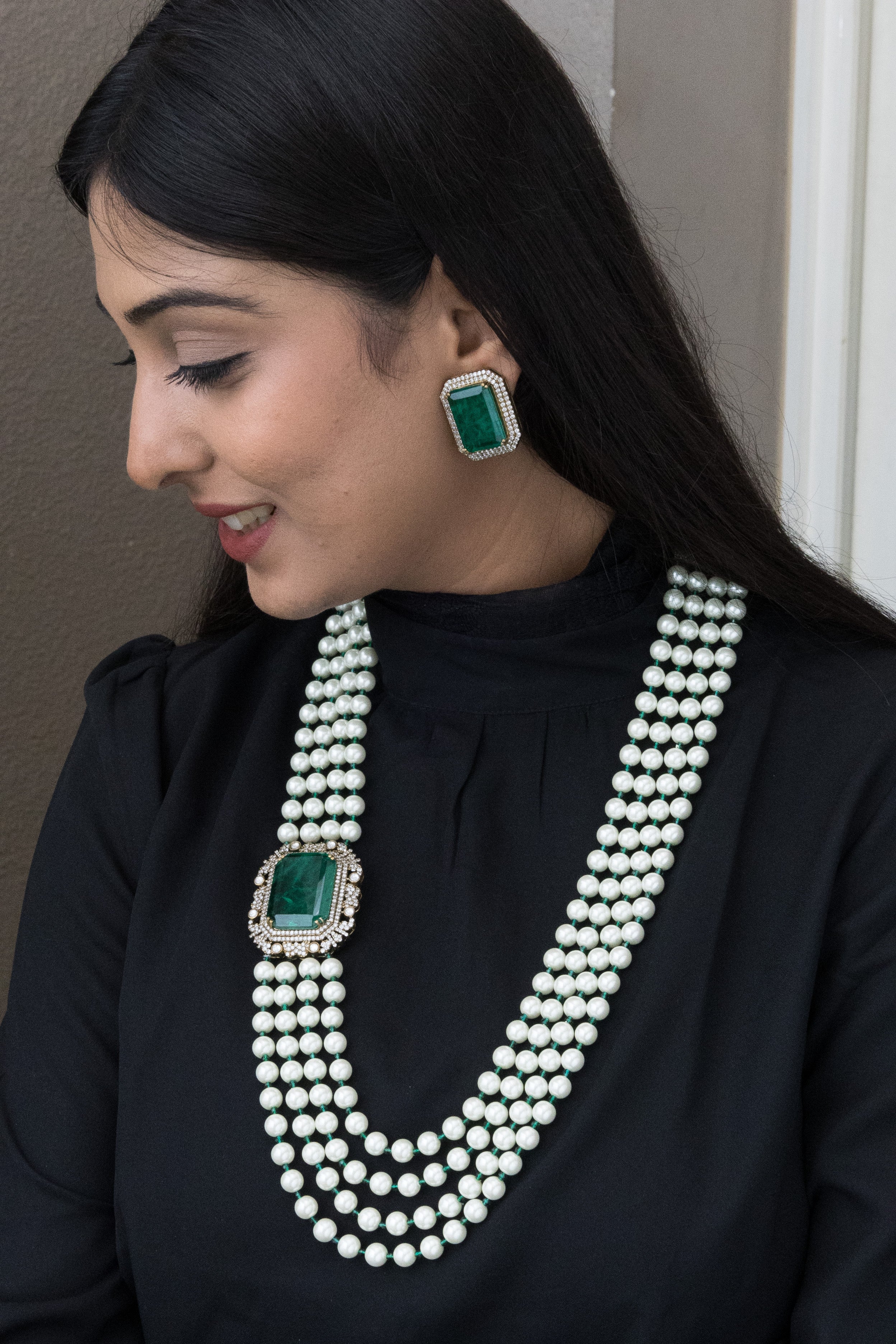 Pearl necklace with emerald centerpiece and regal frame in Arabella Regalia set