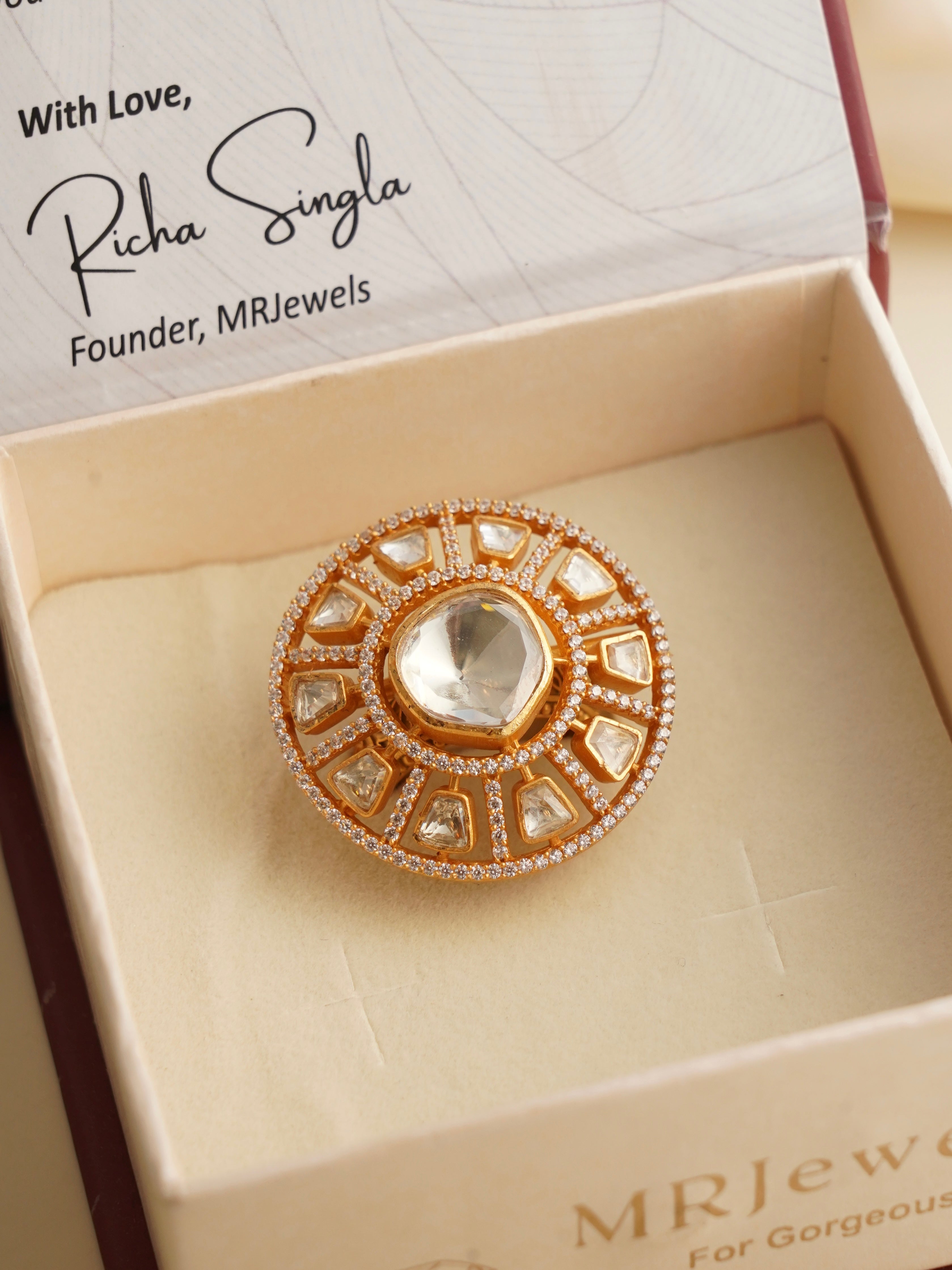 Top view of moissanite engagement ring featuring a round-cut stone in a split shank setting