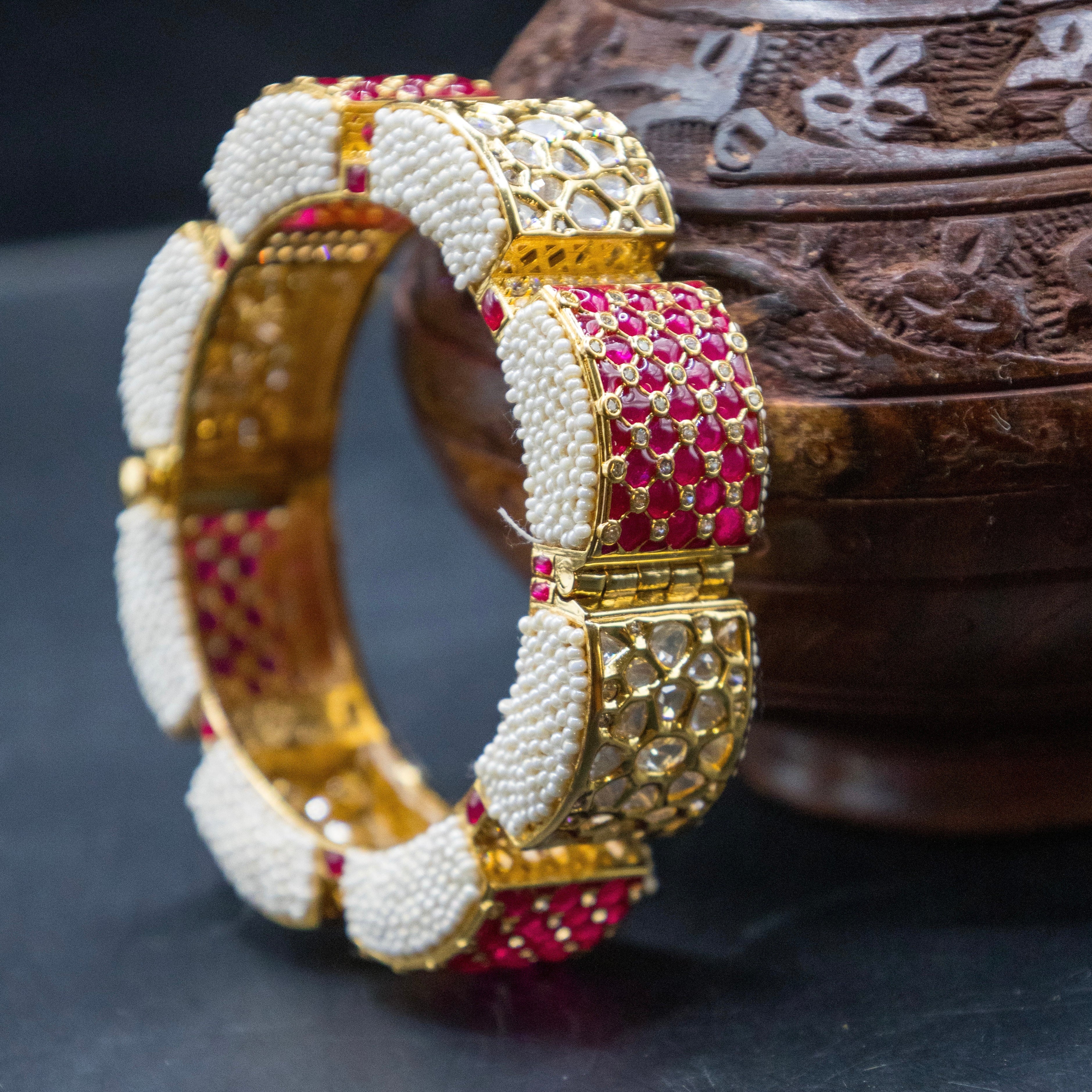Green meenakari kadas with kundan polki stones and traditional gold finish, front display