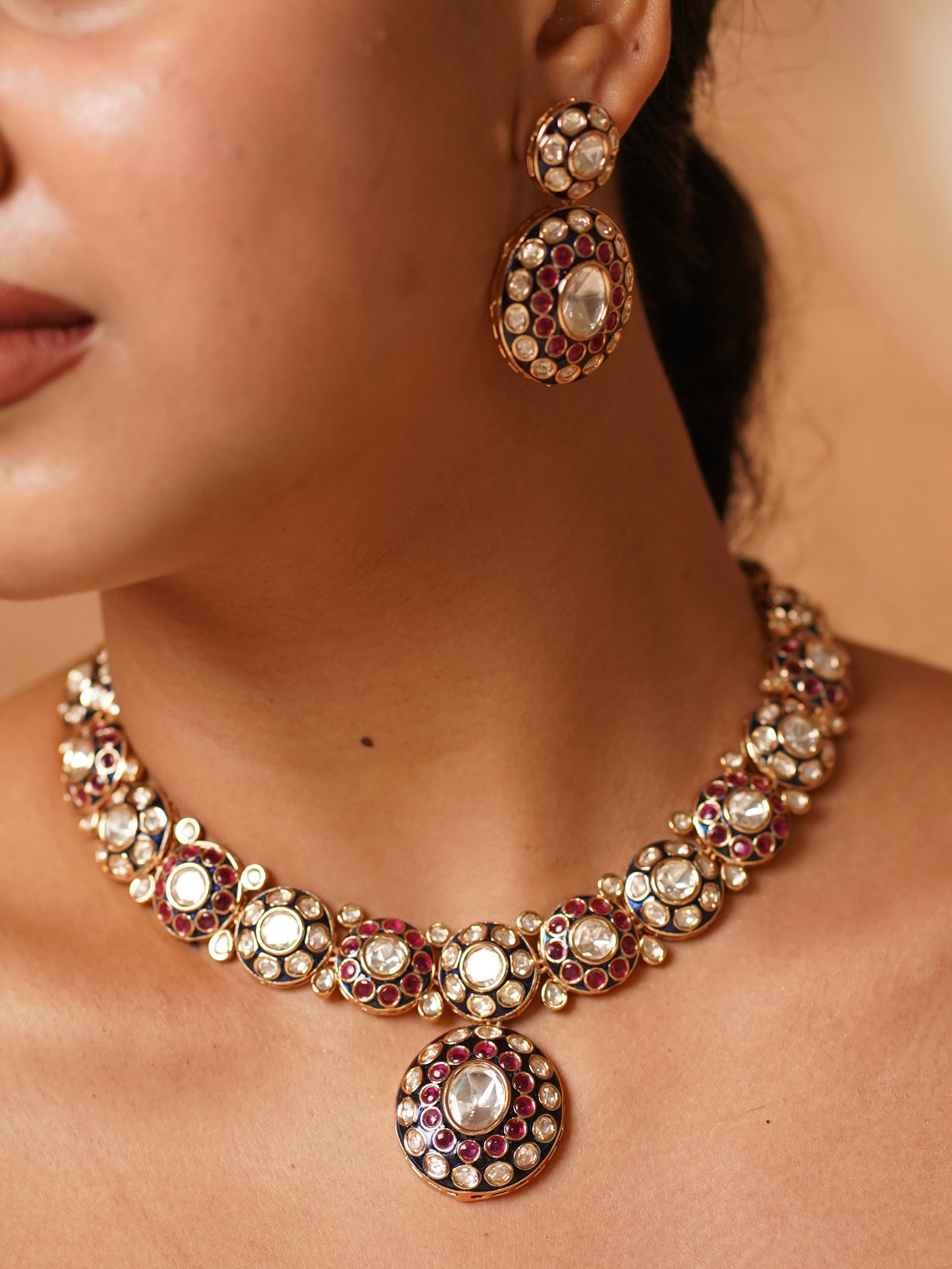 Kundan necklace with maroon meenakari work and matching earrings, crafted in traditional style