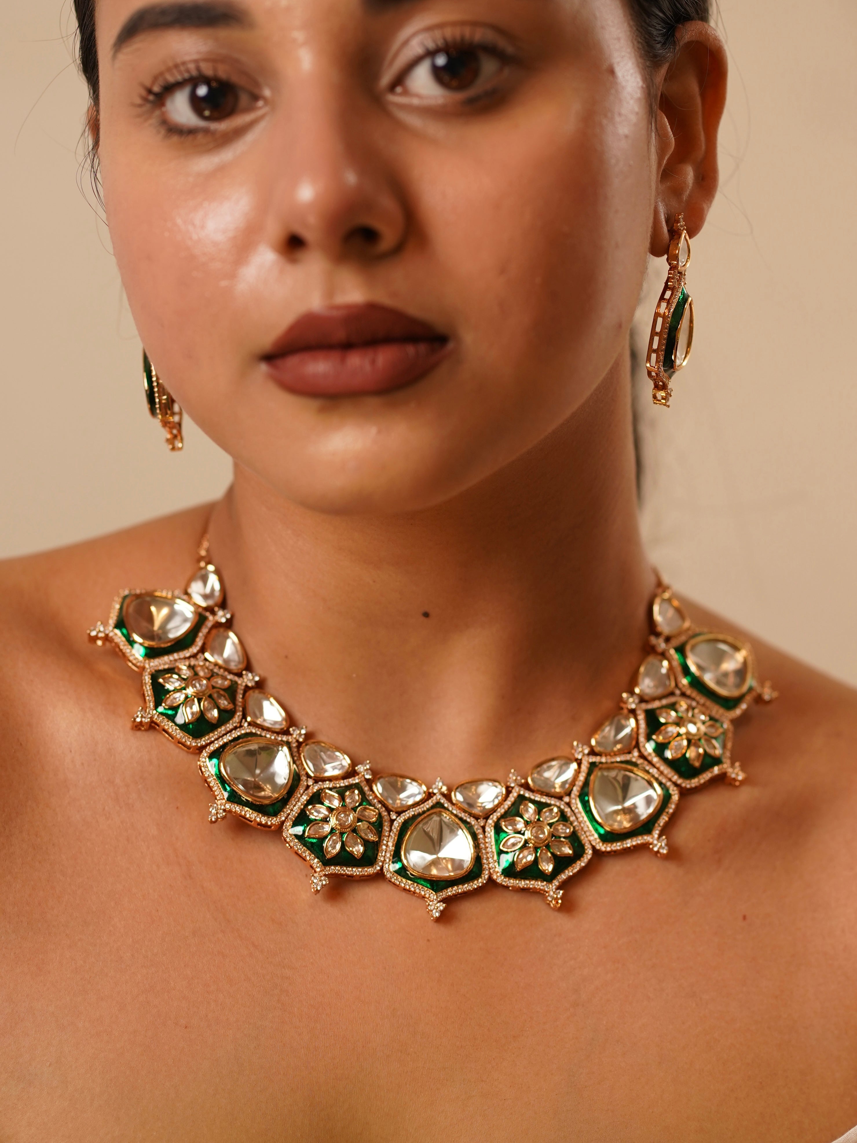 Close-up of kundan set showing green enamel detailing and intricate polki stonework