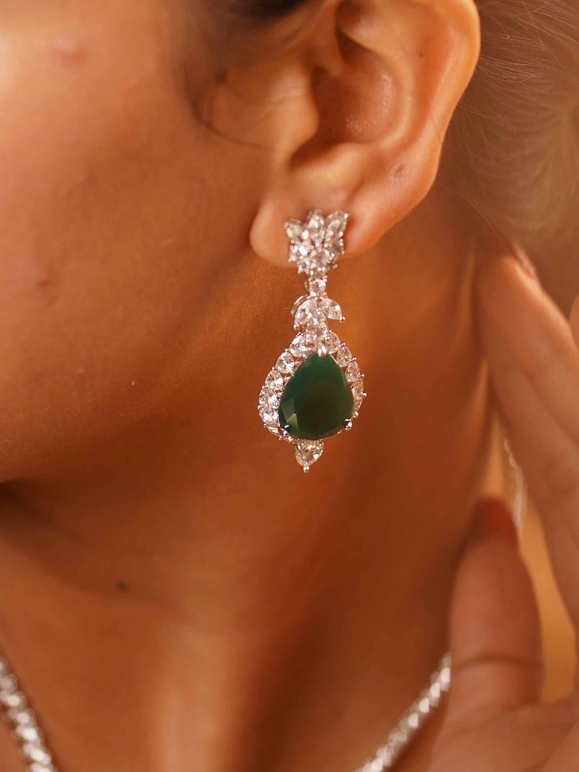 Close-up view of emerald necklace pendant with tiered design and symmetrical layout